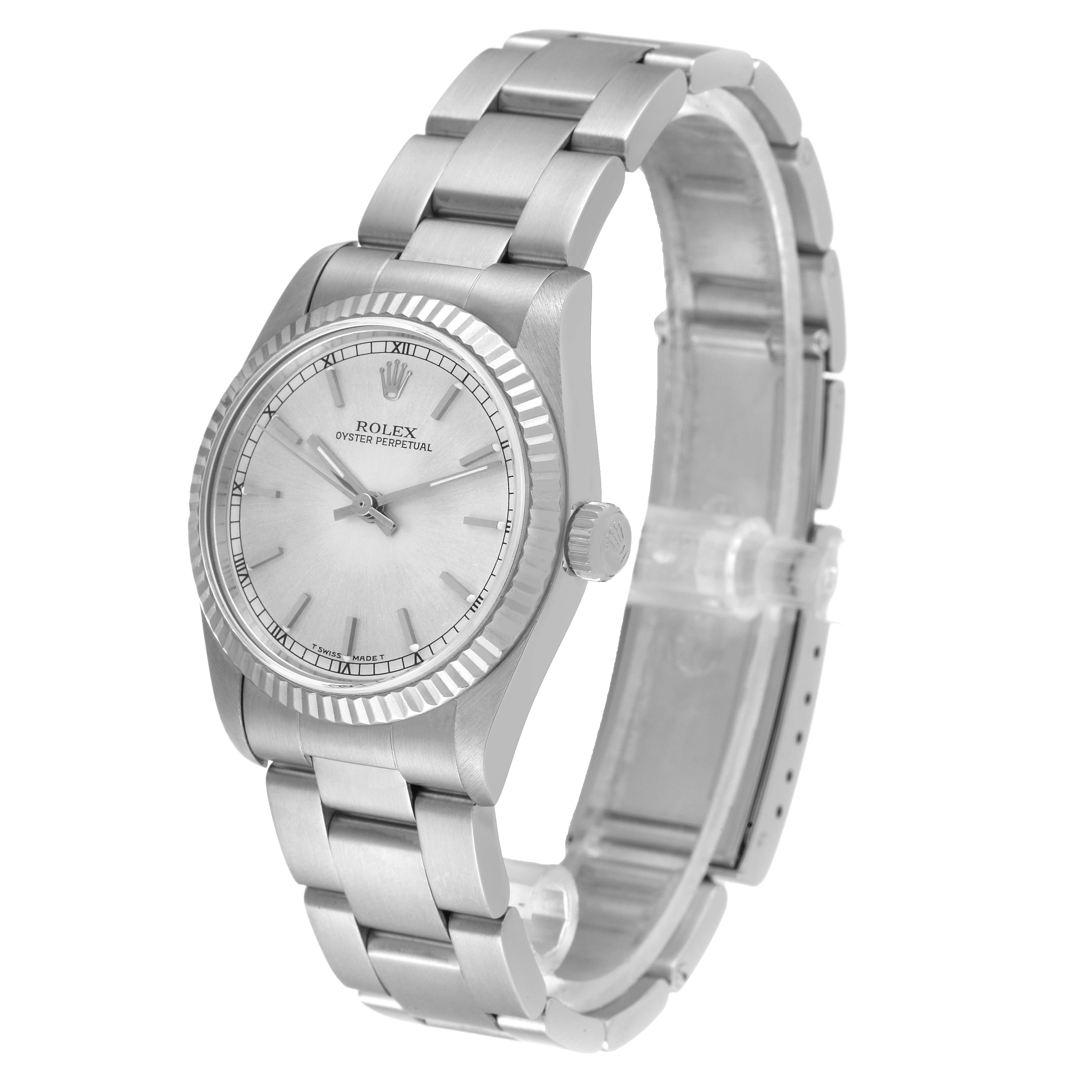 The watch is a Rolex Mid-Size 67514 Women
s Stainless Steel Silver Dial 67514 Women
s Stainless Steel Silver Dial model shown at a three-quarter angle, displaying the face, band, and crown.