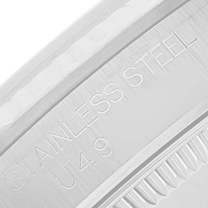 Close-up angle showing the engraving on the stainless steel bezel of a Mid-Size Rolex watch.