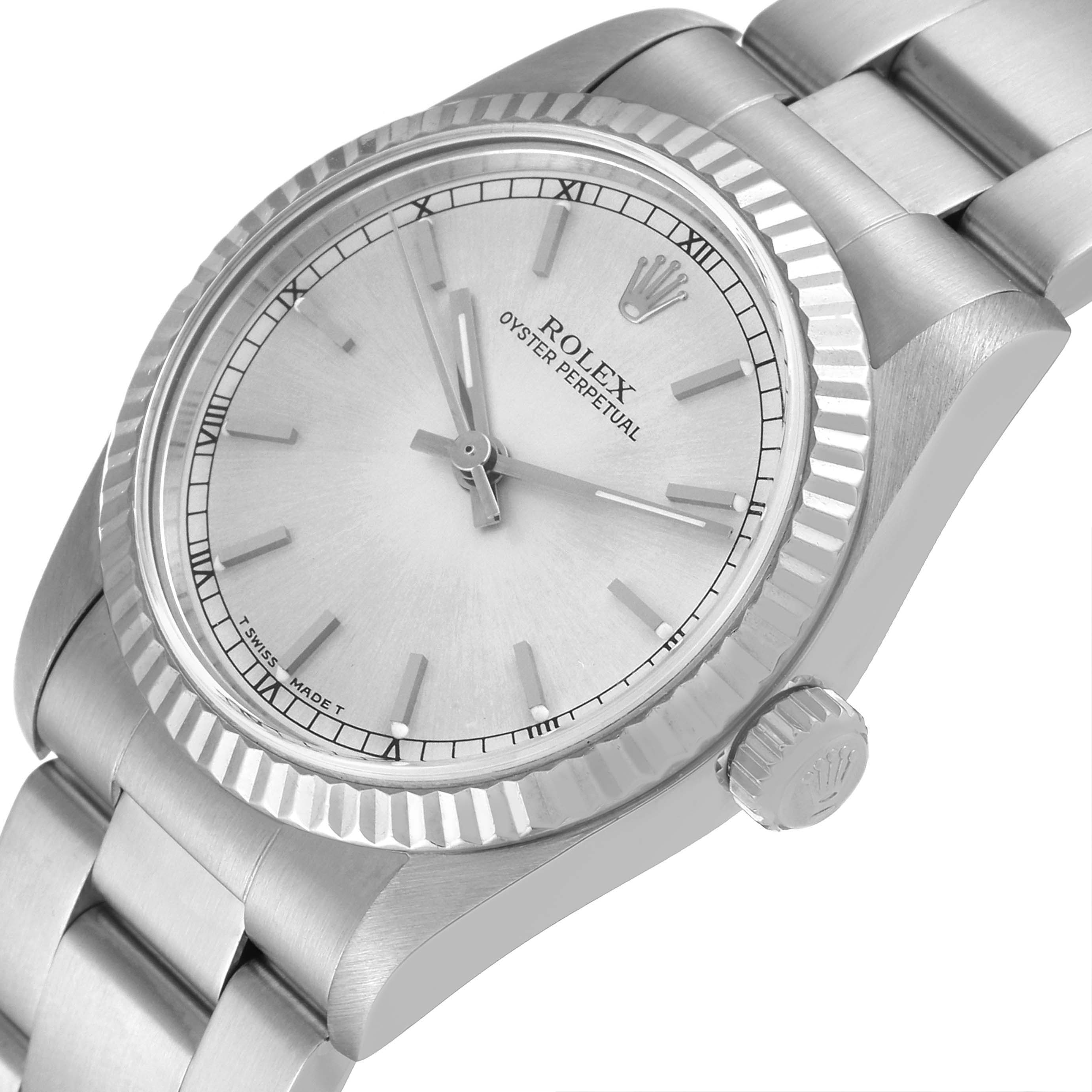 The Rolex Mid-Size 67514 Women
s Stainless Steel Silver Dial 67514 Women
s Stainless Steel Silver Dial model is shown from a slightly tilted top view, highlighting the dial, bezel, crown, and part of the bracelet.