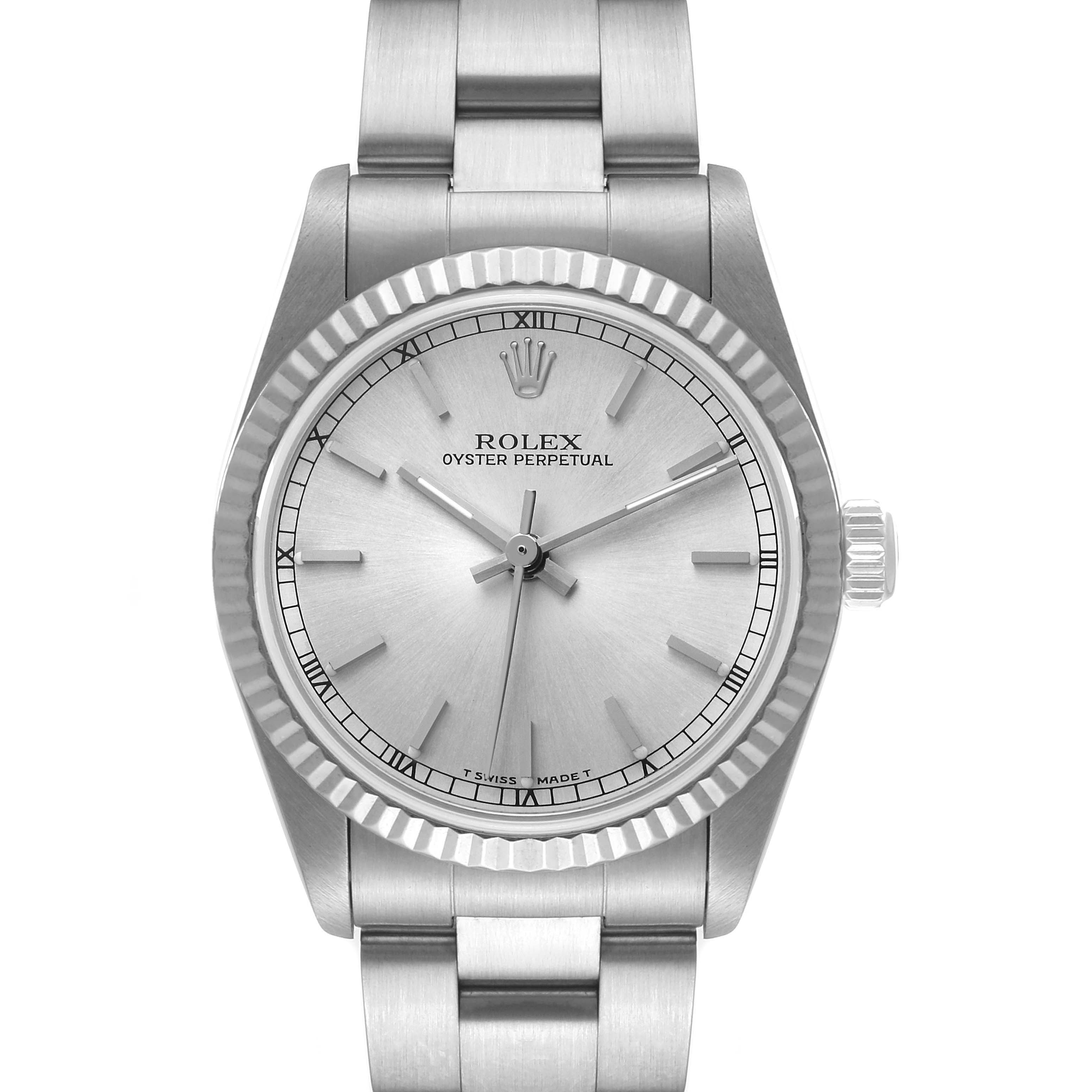 The image shows a front view of a Rolex Mid-Size 67514 Women
s Stainless Steel Silver Dial 67514 Women
s Stainless Steel Silver Dial Oyster Perpetual watch, highlighting the dial, bezel, crown, and part of the bracelet.