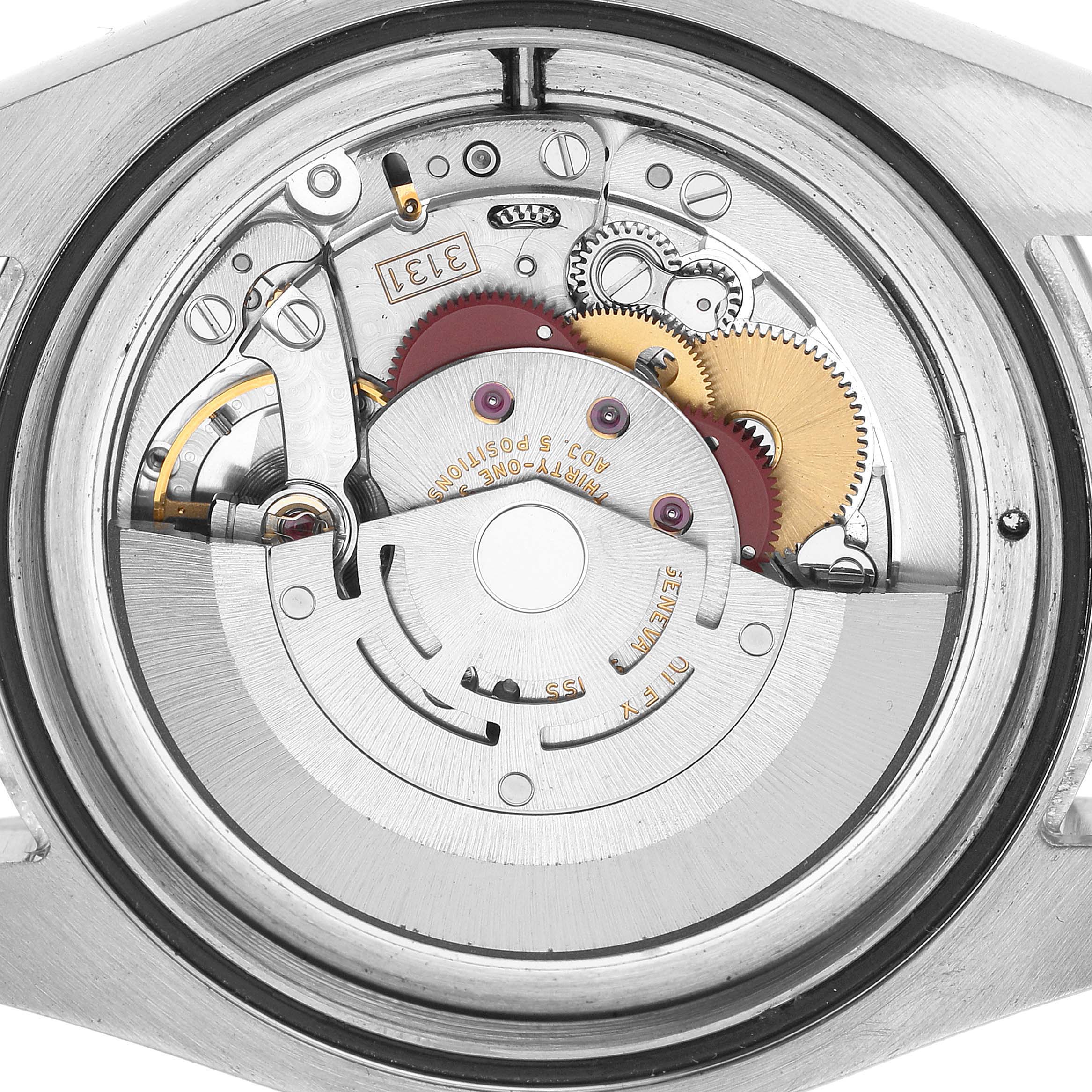The image shows the inner mechanical movement of a Rolex Milgauss 116400 Men's Stainless Steel Black Dial watch, viewed from the back.