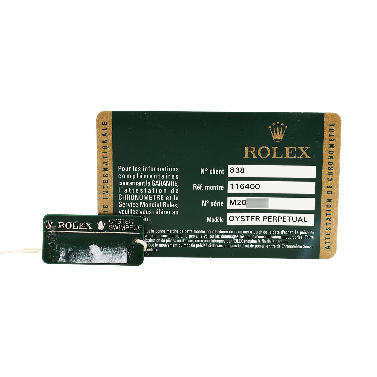 The image shows a Rolex Milgauss 116400 Men's Stainless Steel Black Dial certification card and tag, displaying model, reference, and serial information.