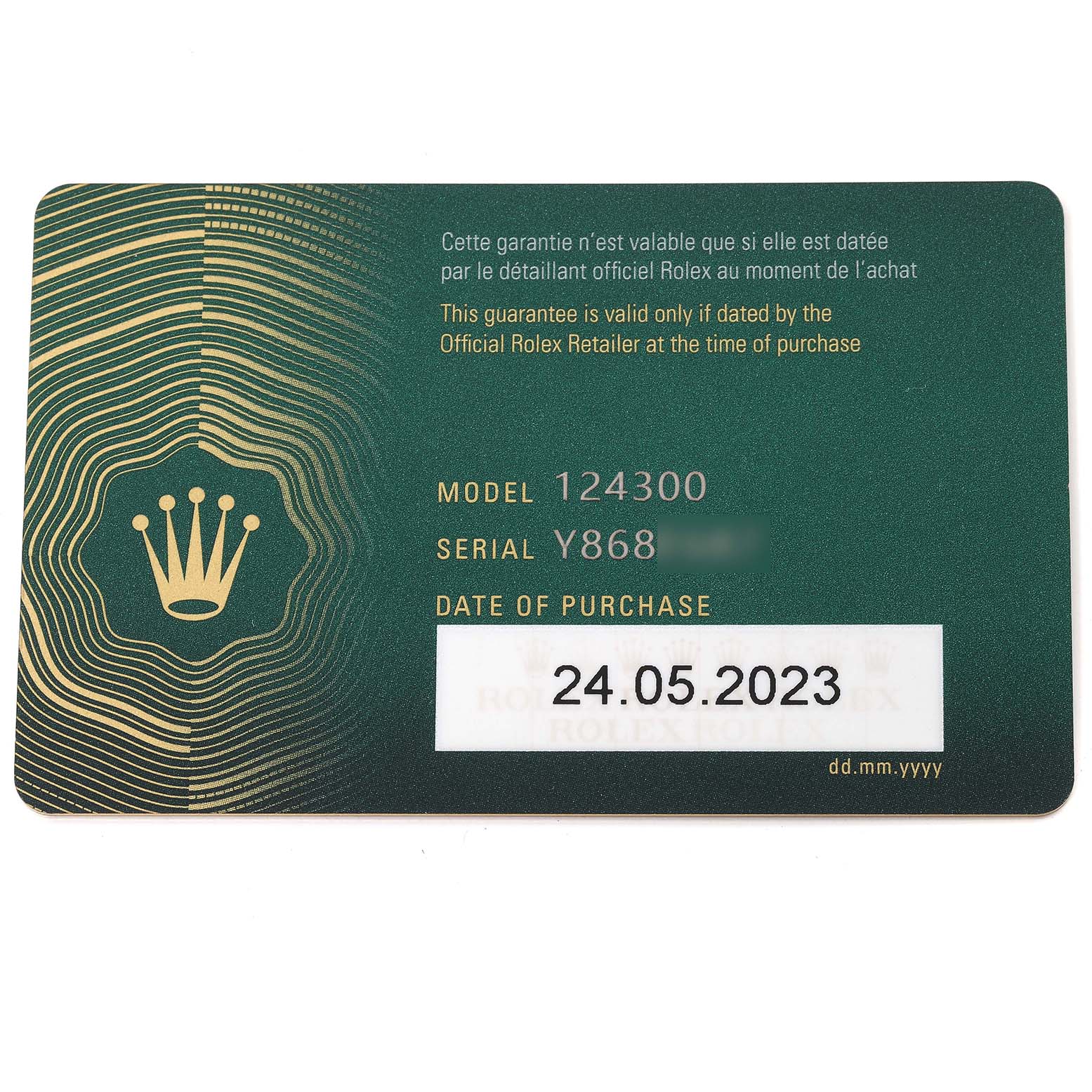 This image shows the guarantee card for a Rolex Oyster Perpetual 124300 Men's Stainless Steel Silver Dial 124300 Men's Stainless Steel Silver Dial model 124300, displaying its serial number and date of purchase.