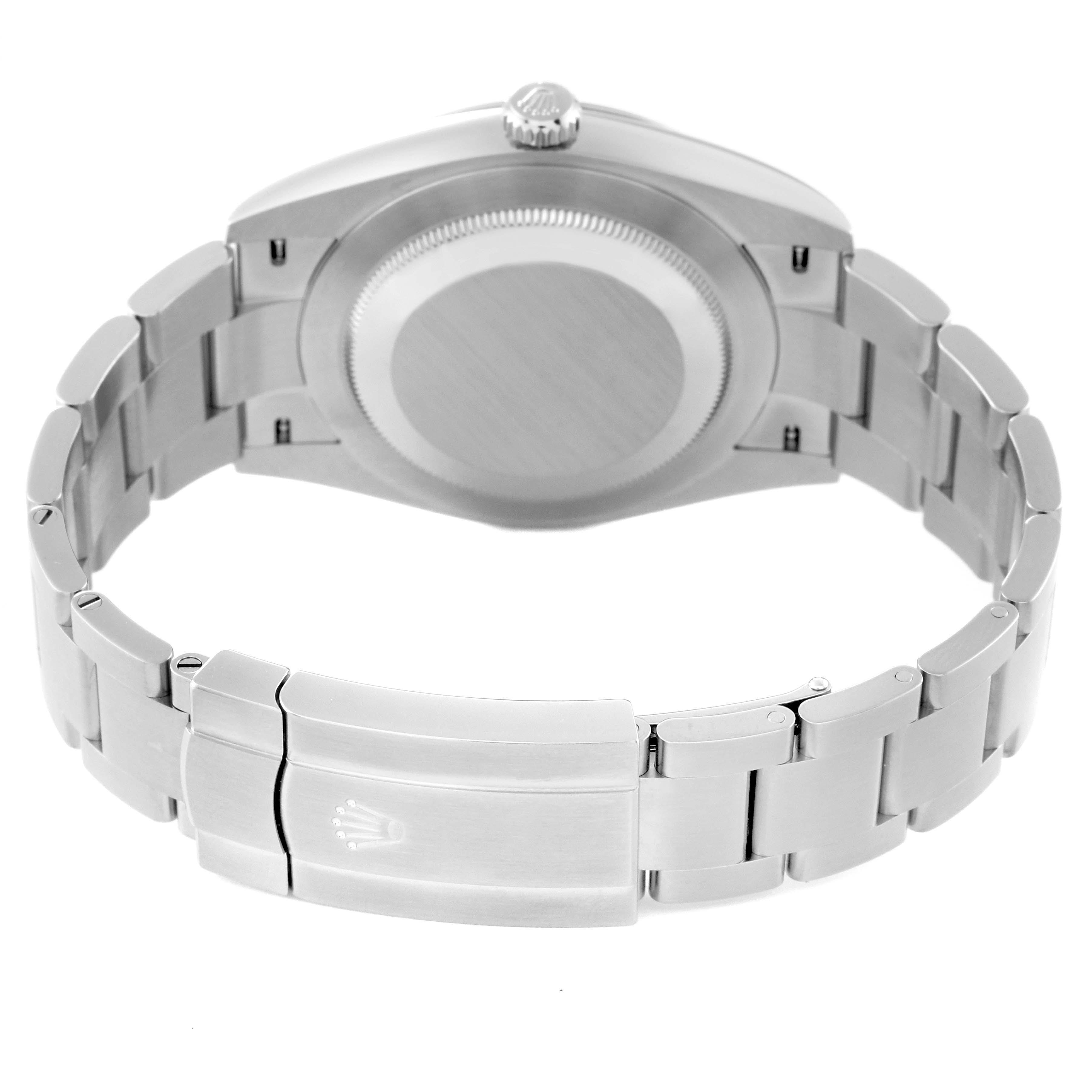 This image shows the backside of the Rolex Oyster Perpetual 124300 Men's Stainless Steel Silver Dial 124300 Men's Stainless Steel Silver Dial watch, focusing on the case back and the clasp with the Rolex logo.