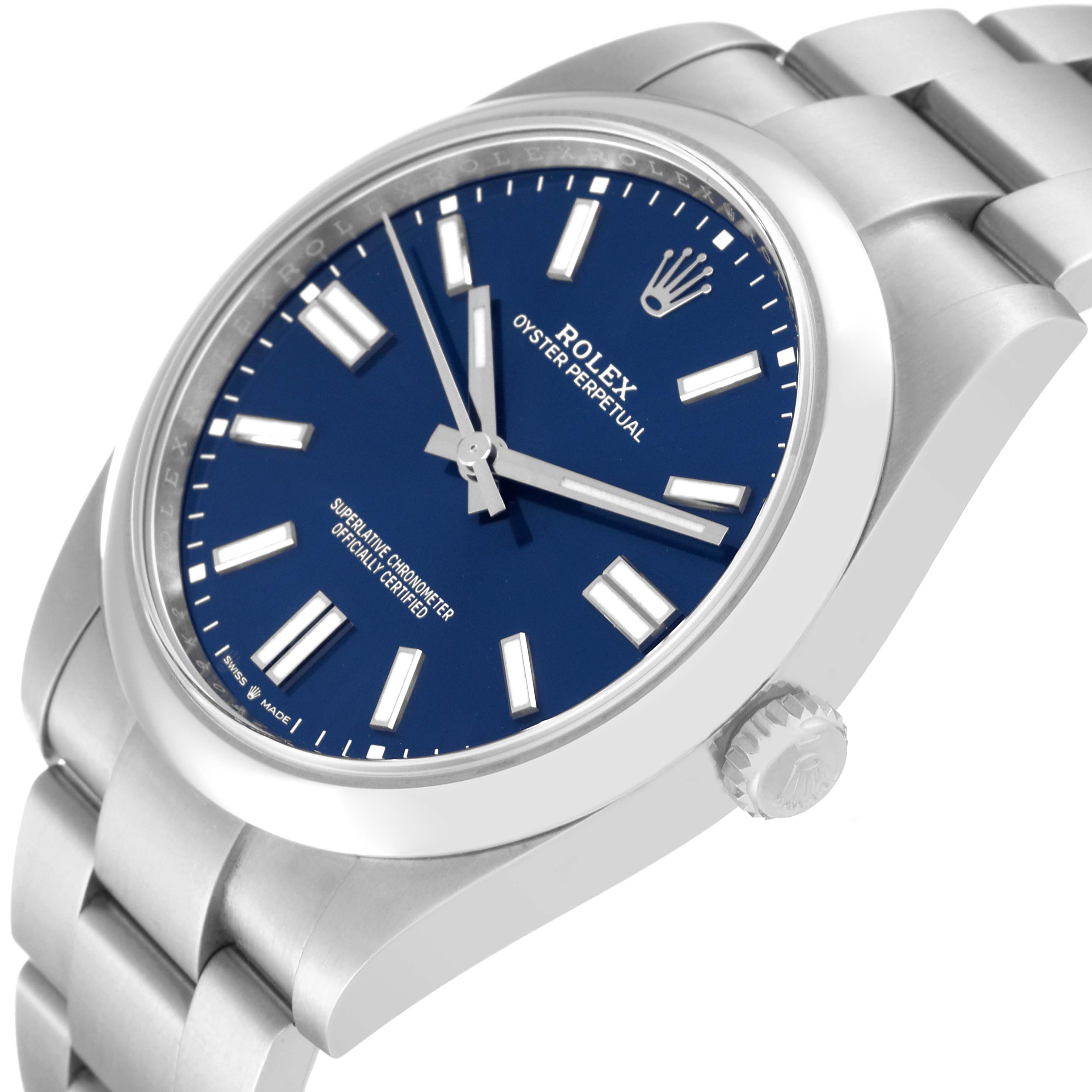 The image shows a close-up side angle of the Rolex Oyster Perpetual 124300 Men's Stainless Steel Blue Dial 124300 Men's Stainless Steel Blue Dial watch, highlighting its blue dial, crown, and stainless steel bracelet.