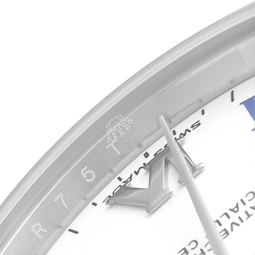 The image shows a close-up of the dial and bezel of the Mid-Size Rolex watch, focusing on the hour markers and minute hand.