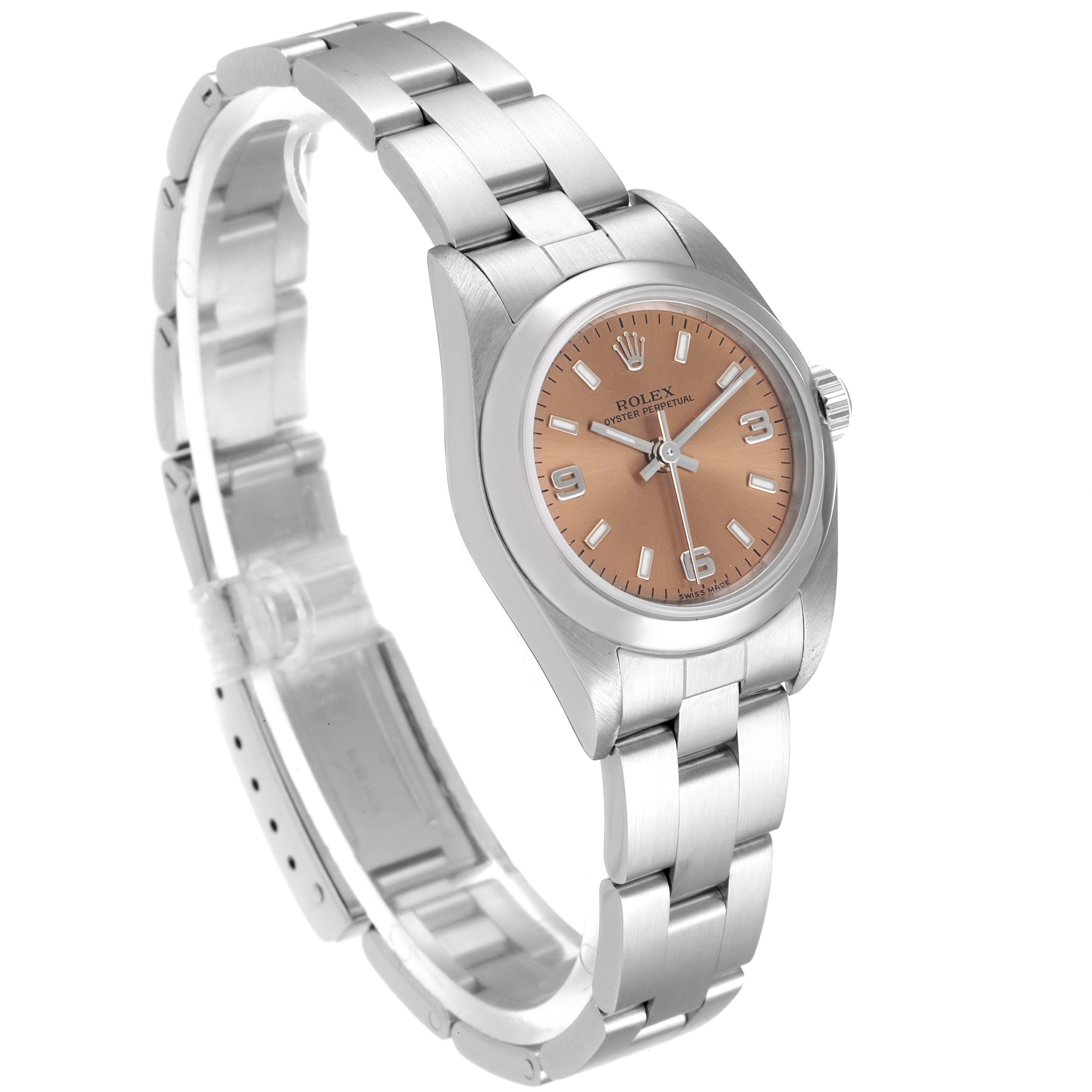 The image shows a side angle of the Rolex Oyster Perpetual 76080 Women's Stainless Steel Pink Dial 76080 Women's Stainless Steel Pink Dial watch, highlighting its bracelet, case, and dial.