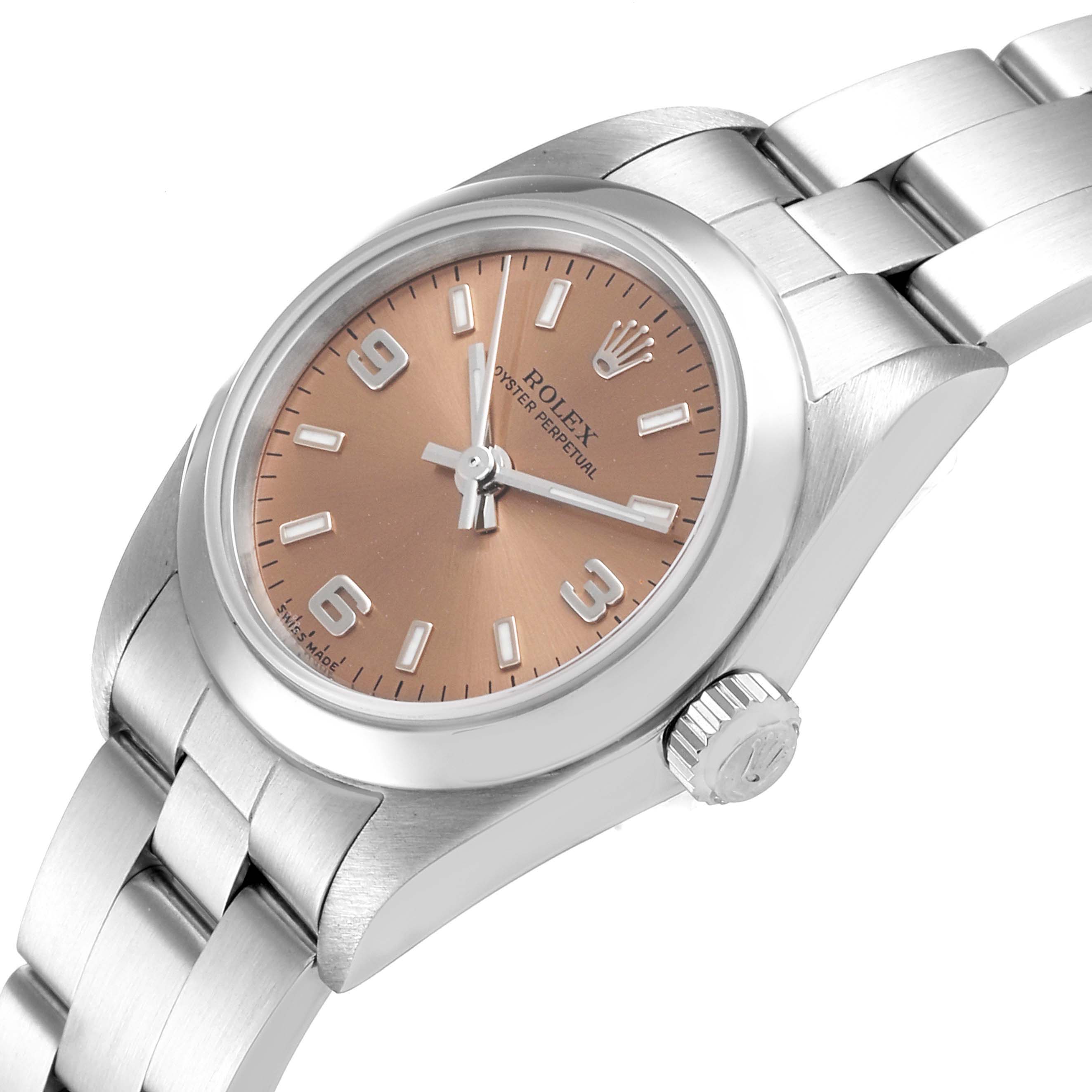 The image shows a close-up side angle of the Rolex Oyster Perpetual 76080 Women's Stainless Steel Pink Dial 76080 Women's Stainless Steel Pink Dial watch, highlighting the dial, bezel, crown, and part of the bracelet.