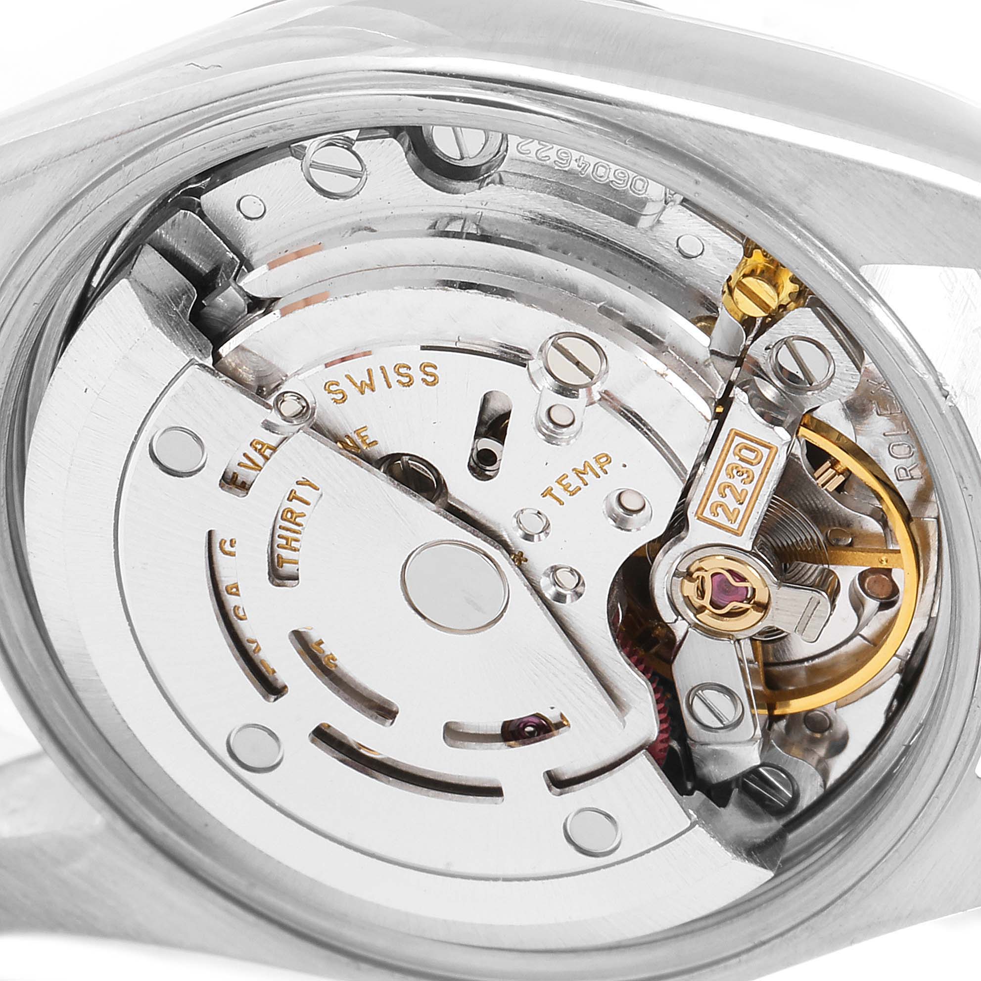 This image shows a close-up of the movement mechanism inside a Rolex Oyster Perpetual 76080 Women's Stainless Steel Pink Dial 76080 Women's Stainless Steel Pink Dial watch.