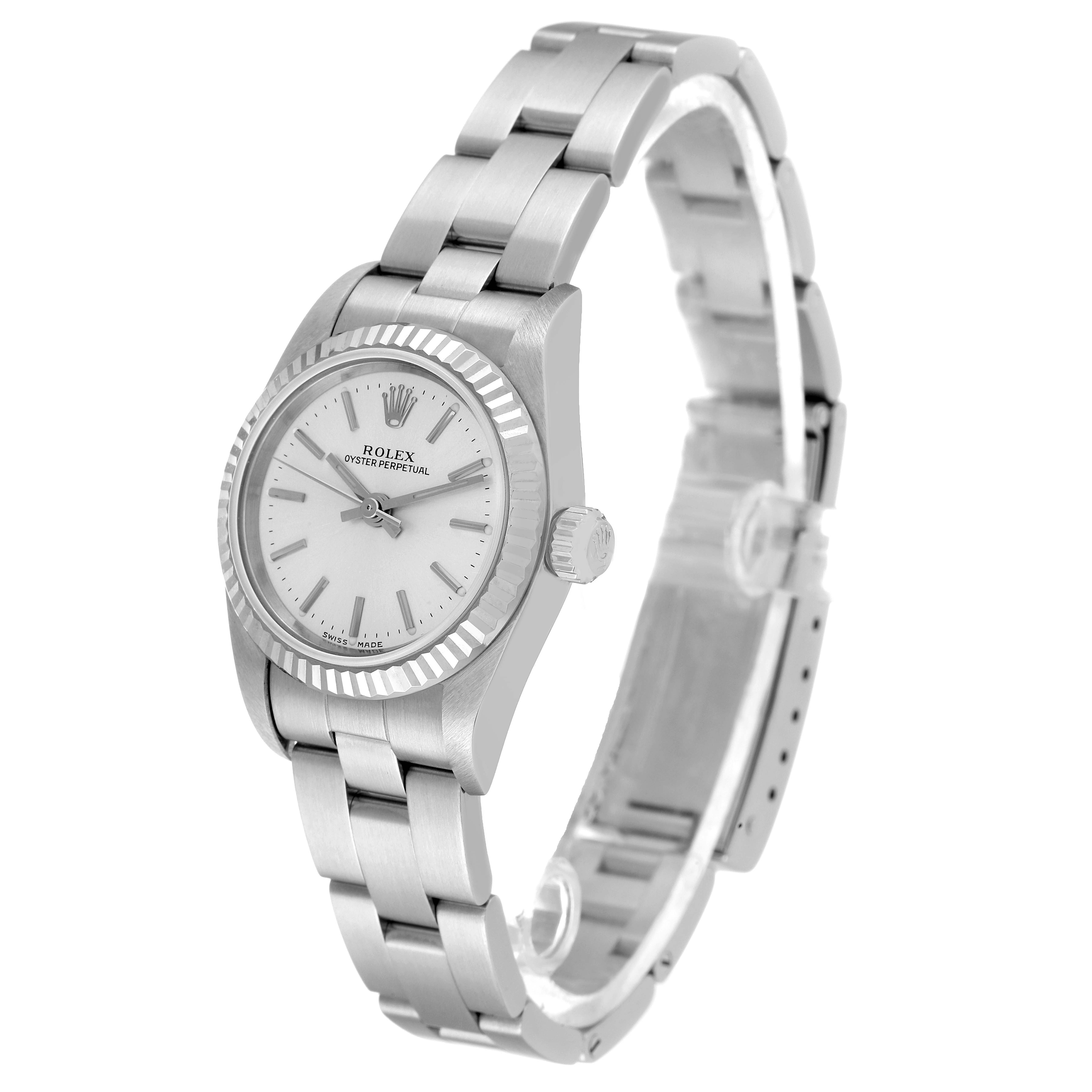 The image shows a side angle of the Rolex Oyster Perpetual 76094 Women
s Stainless Steel Silver Dial 76094 Women
s Stainless Steel Silver Dial watch, displaying the dial, crown, and part of the bracelet.