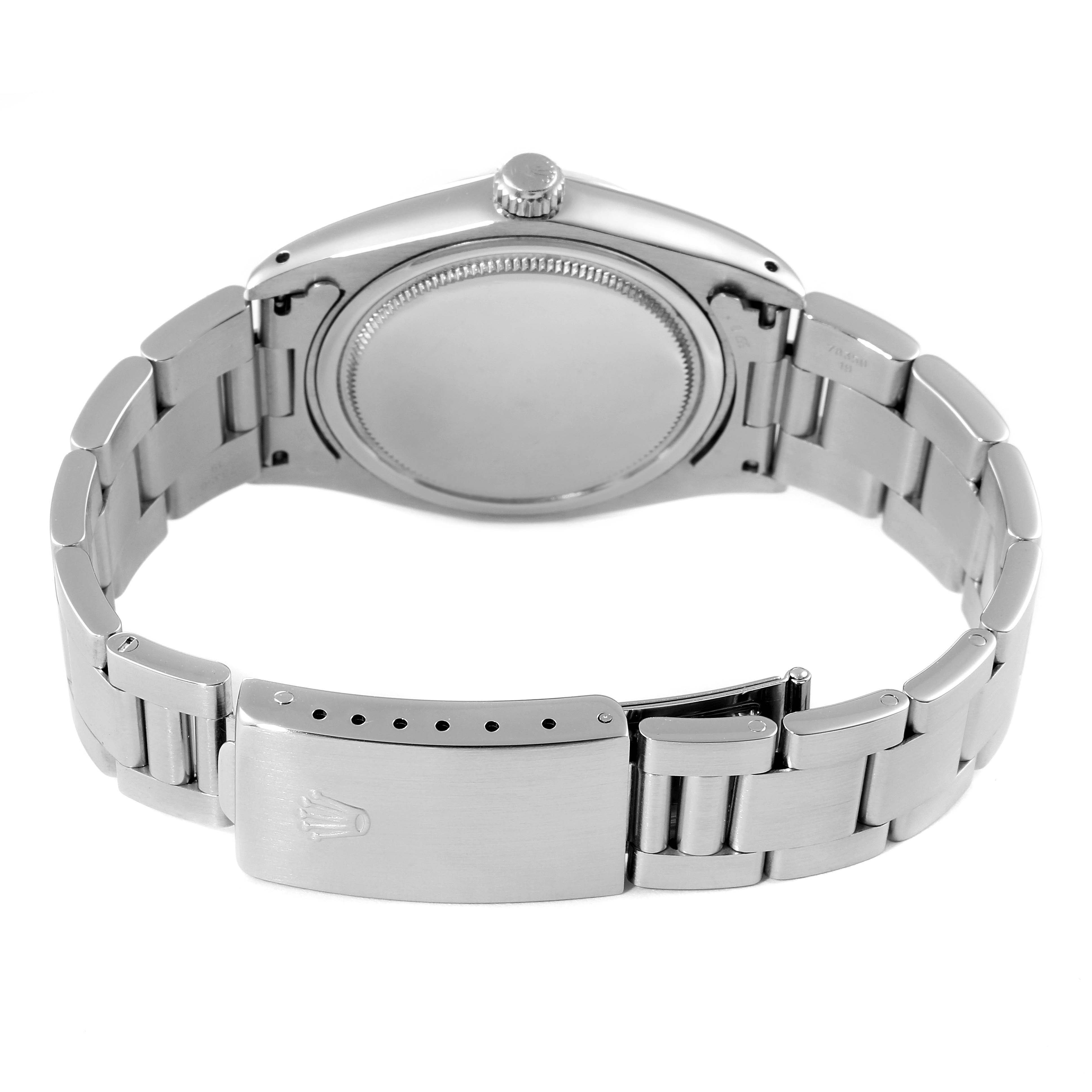 The image shows the back and clasp of a Rolex Vintage Collection 6694 Men's Stainless Steel Brown Dial 6694 Men's Stainless Steel Brown Dial watch, highlighting the case back and bracelet.