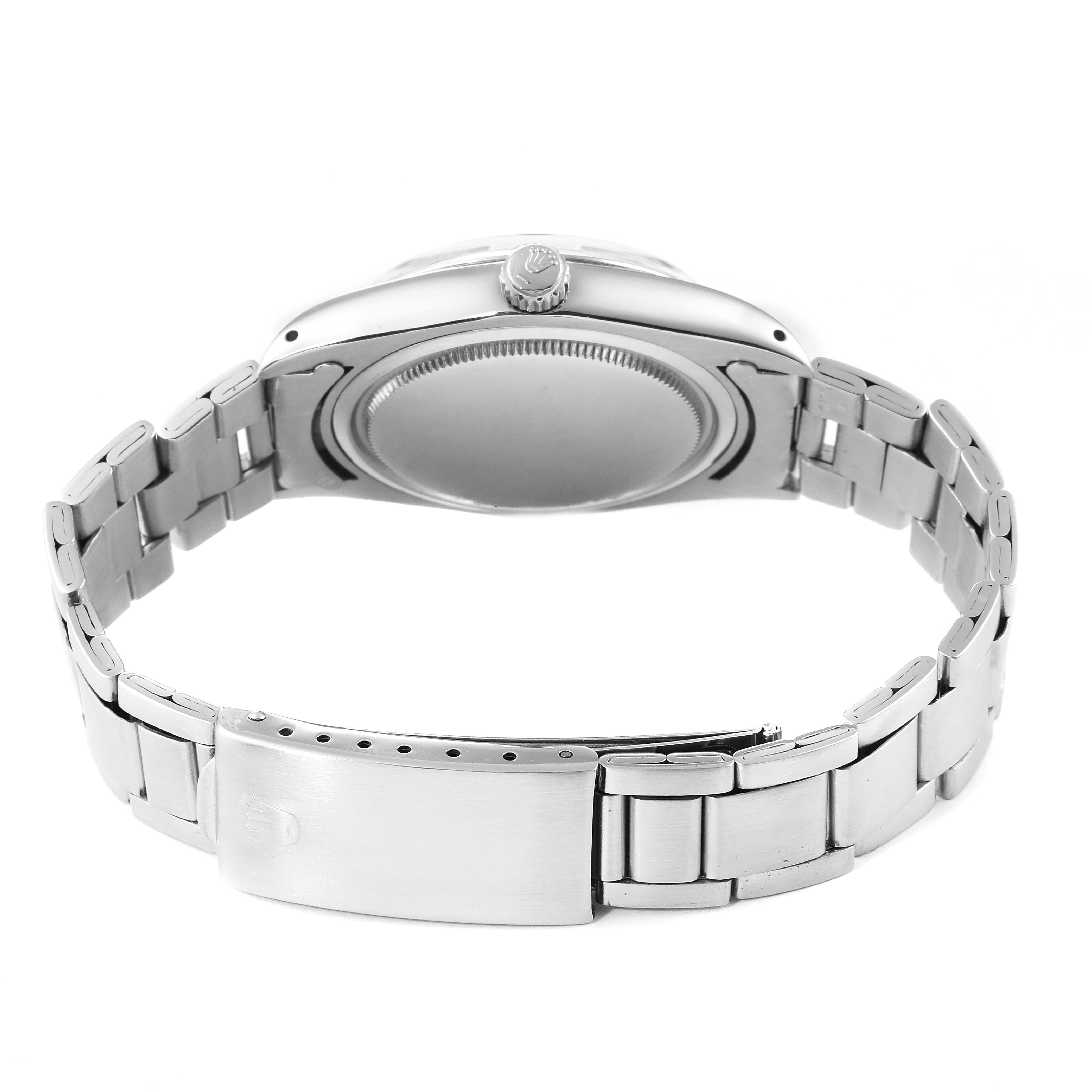 The image shows the back and clasp of a Rolex Vintage Collection 6694 Men's Stainless Steel Champagne Dial 6694 Men's Stainless Steel Champagne Dial model watch, highlighting the bracelet and case back.