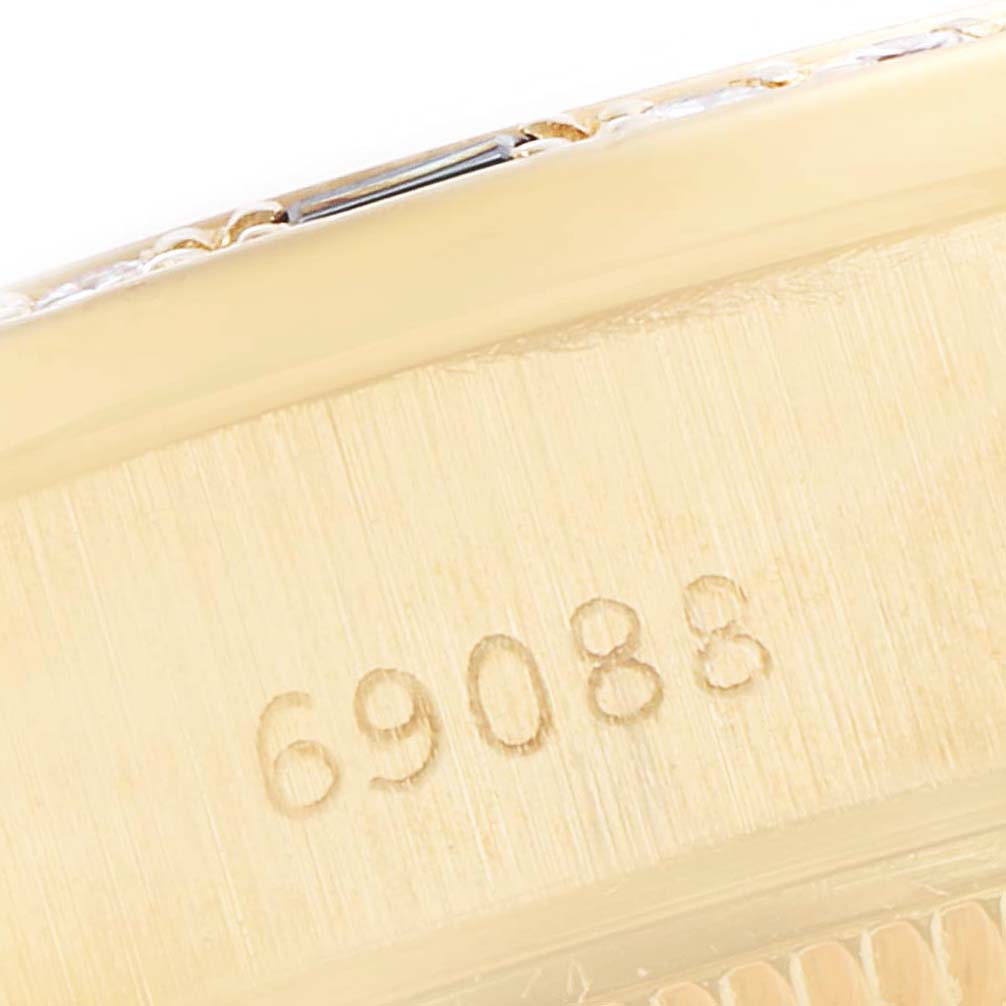 This close-up image shows the engraved model number on the side of a Rolex President 69088 Women's Yellow Gold Blue Dial 69088 Women's Yellow Gold Blue Dial watch.