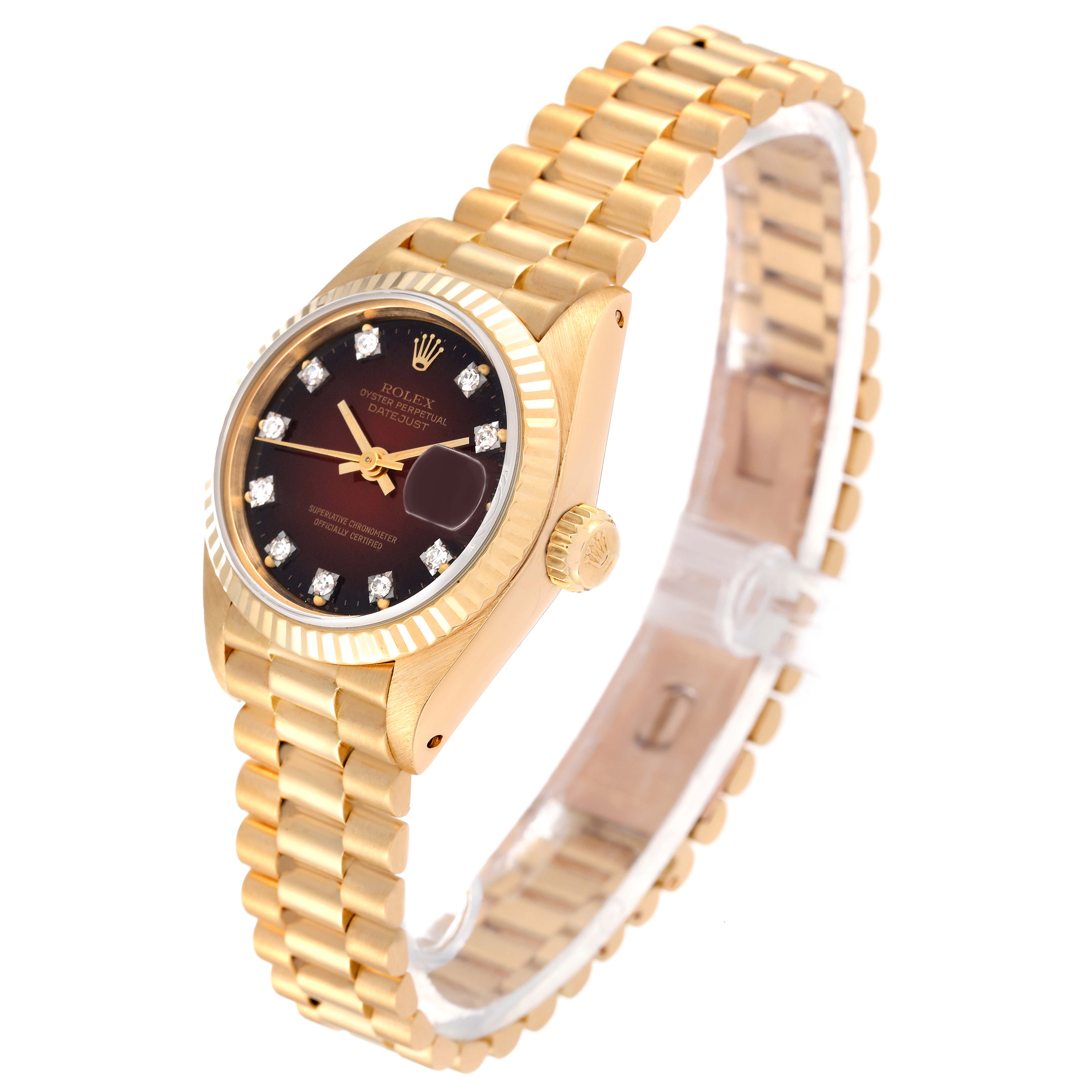 The Rolex President 69178 Women's Yellow Gold Red Dial 69178 Women's Yellow Gold Red Dial model watch is shown at a 45-degree angle, displaying its gold bracelet, black dial with diamond markers, and fluted bezel.