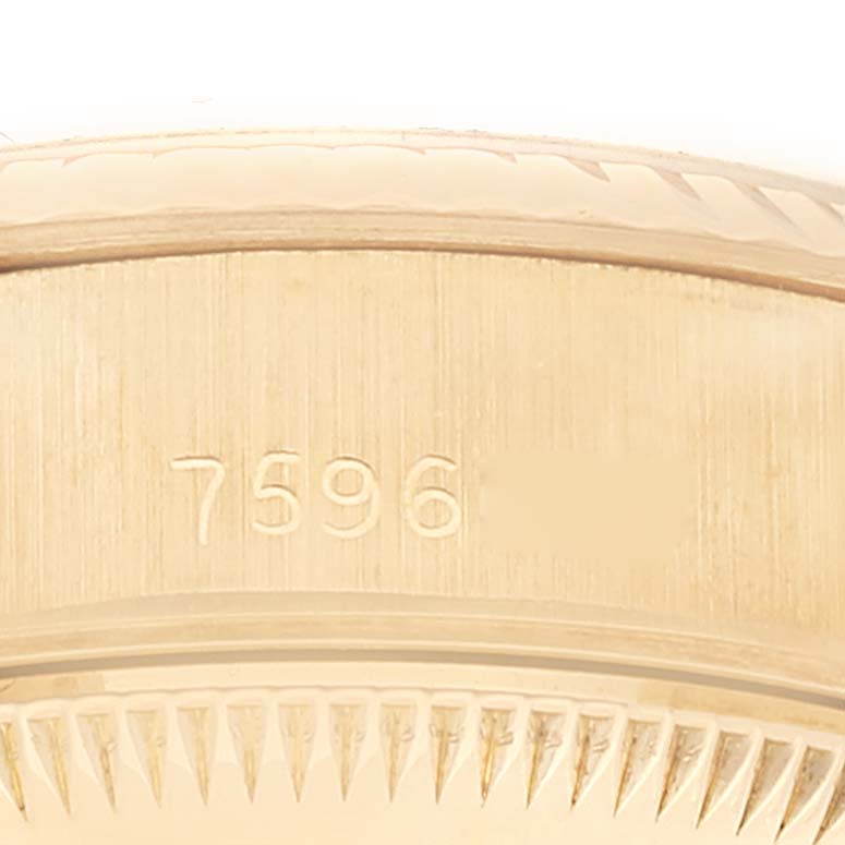 This close-up image shows the caseback and model number 7596 of a Rolex President 69178 Women's Yellow Gold Red Dial 69178 Women's Yellow Gold Red Dial watch.