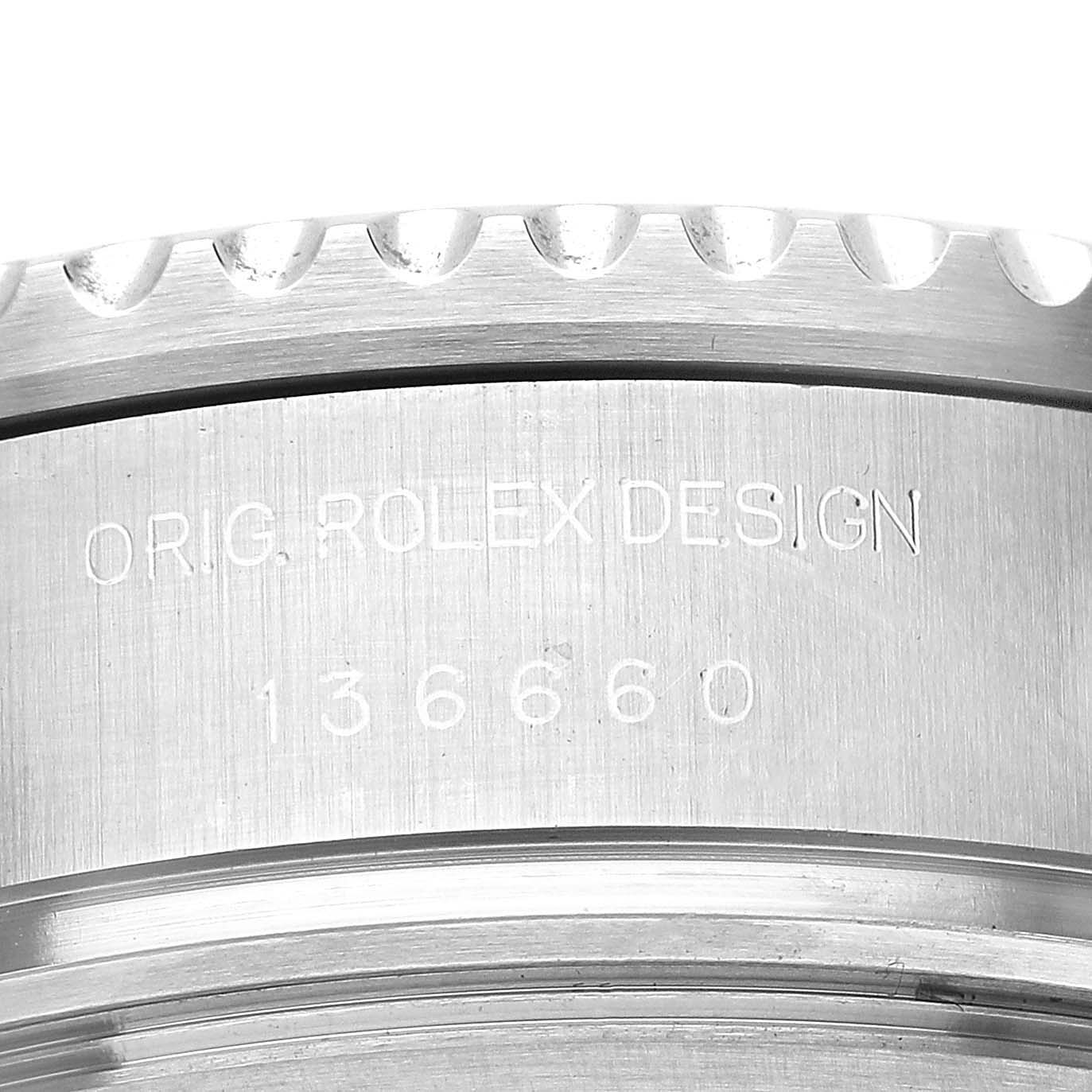The image shows a close-up of the case side of a Rolex Sea-Dweller 136660 Men's Stainless Steel Black Dial, focusing on the engravings.