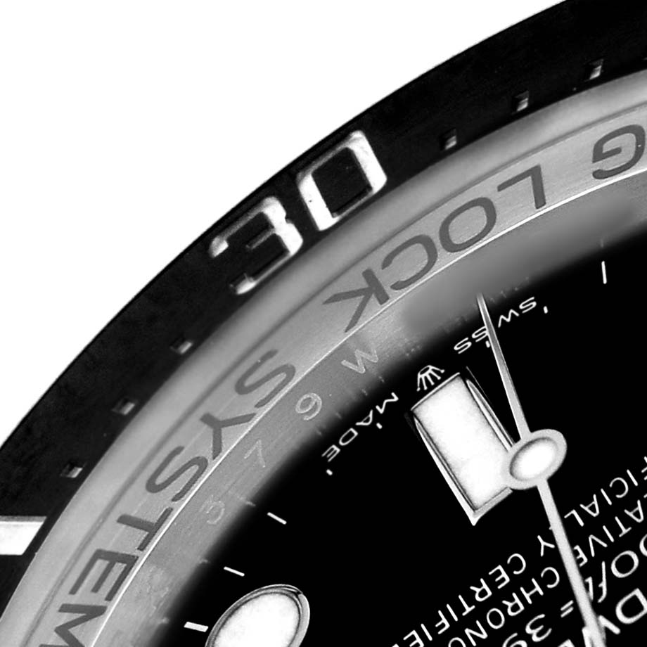 The image shows a close-up of the bezel and part of the dial on a Rolex Sea-Dweller 136660 Men's Stainless Steel Black Dial watch.