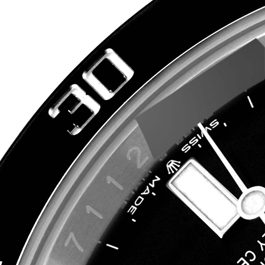 The image shows a close-up of the bezel, the 30-minute mark, and part of the dial and hand of a Rolex Submariner 126610 Men
s Stainless Steel Black Dial 126610 Men
s Stainless Steel Black Dial watch.