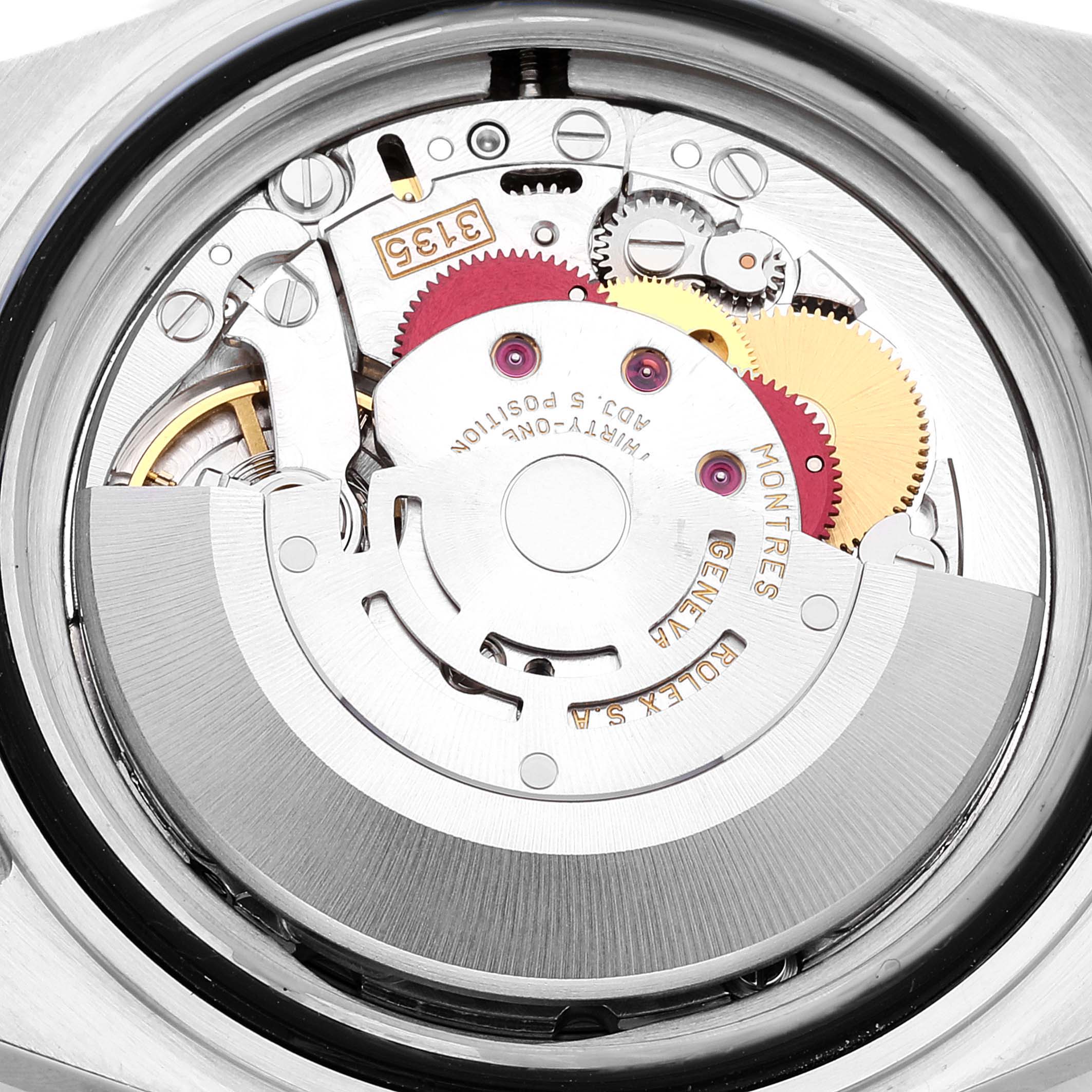 The image shows the intricate internal mechanism of a Rolex Submariner 16613 Men
s Steel and Gold (two tone) Blue Dial 16613 Men
s Steel and Gold (two tone) Blue Dial watch, viewed from the back, exposing gears and the movement parts.