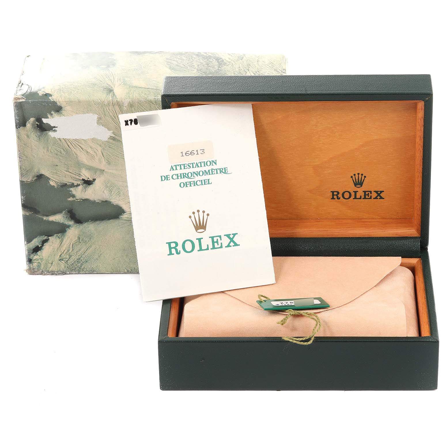 This image shows the packaging of a Rolex Submariner 16613 Men
s Steel and Gold (two tone) Blue Dial 16613 Men
s Steel and Gold (two tone) Blue Dial, including a box, warranty card, and a manual.