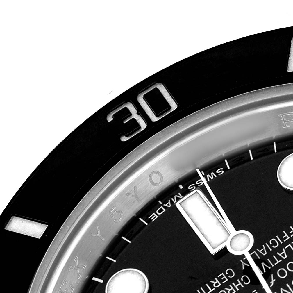 The image shows a close-up of the Rolex Submariner M116610LN-0001 Men's Stainless Steel Black Dial bezel at the 30-minute mark, with part of the dial visible.