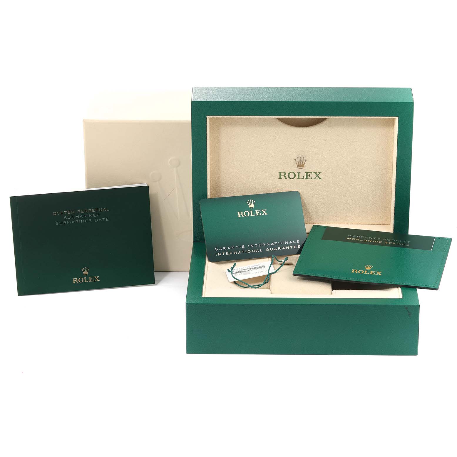 The image shows a green Rolex box for the Submariner model along with warranty cards and an instruction manual.