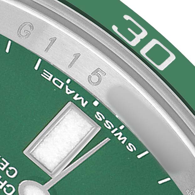 The image shows a close-up of the Rolex Submariner 116610LV Men's Stainless Steel Green Dial's green bezel, hour markers, and partial dial details.