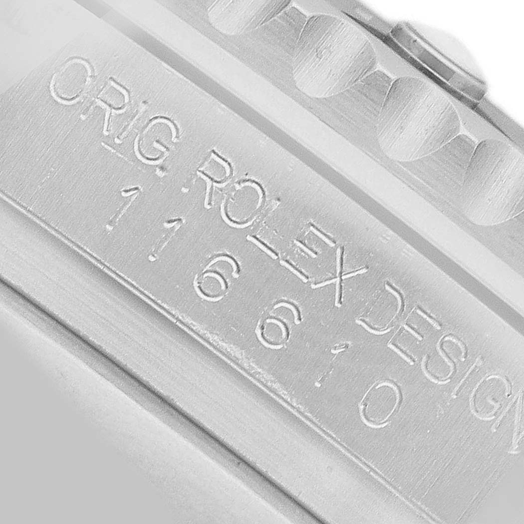 The image shows a close-up of the case side of a Rolex Submariner 116610LV Men's Stainless Steel Green Dial, highlighting the engraved model number.