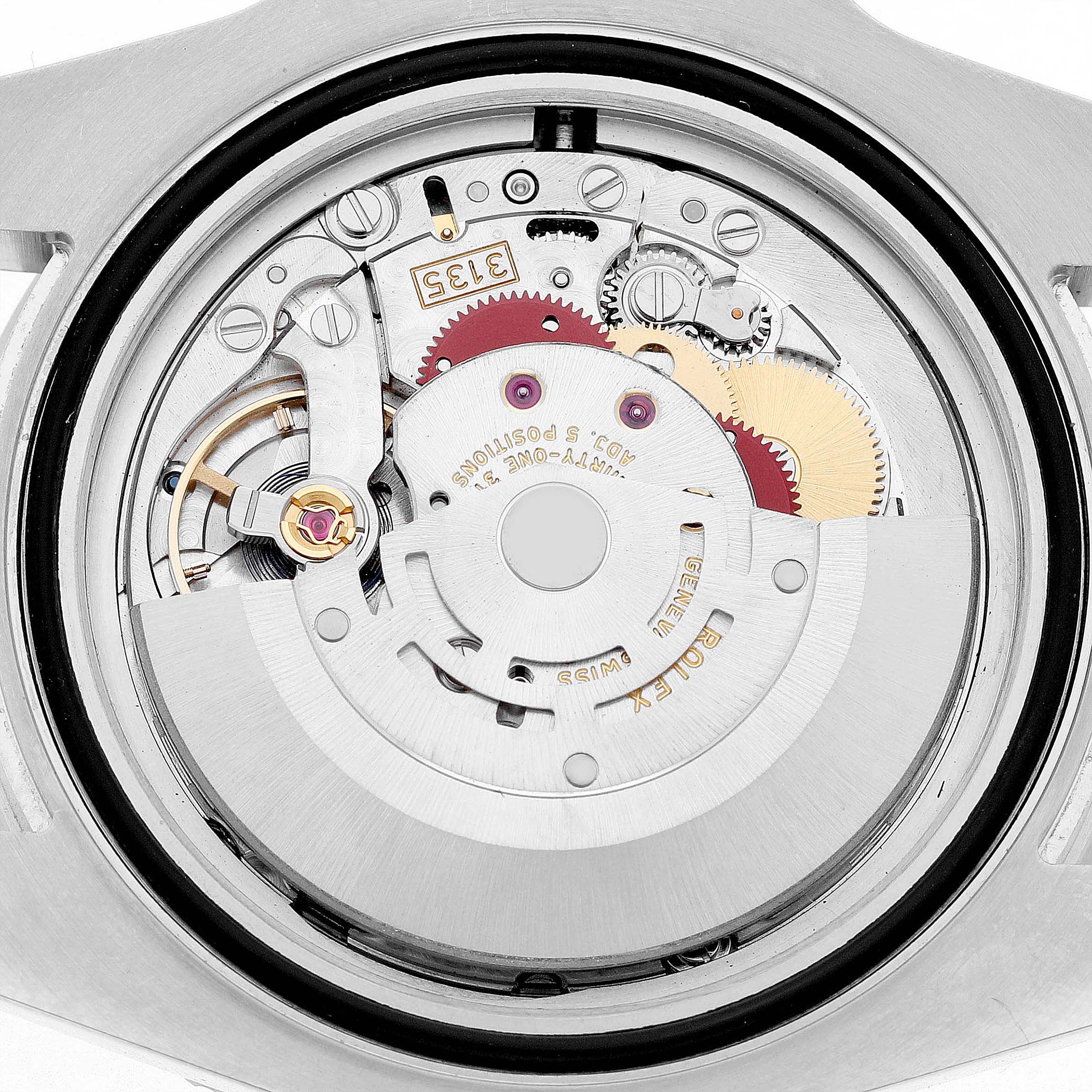 The image shows the back view of a Rolex Submariner 116610LV Men's Stainless Steel Green Dial's movement, displaying its intricate mechanical components.