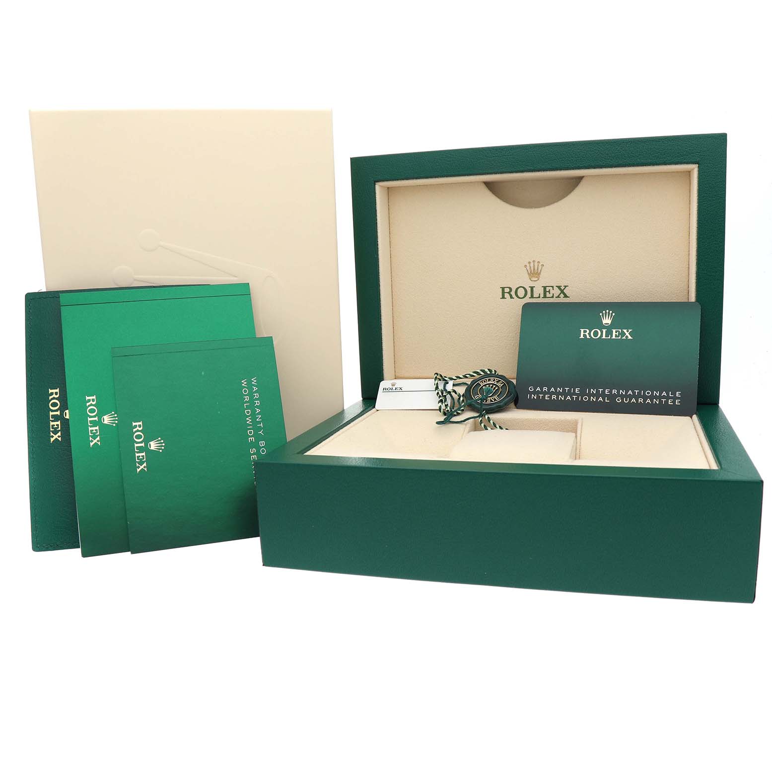 The image shows a Rolex Submariner M124060-0001 Men's Stainless Steel Black Dial model green box with warranty booklets and accessories from a top-front angle.
