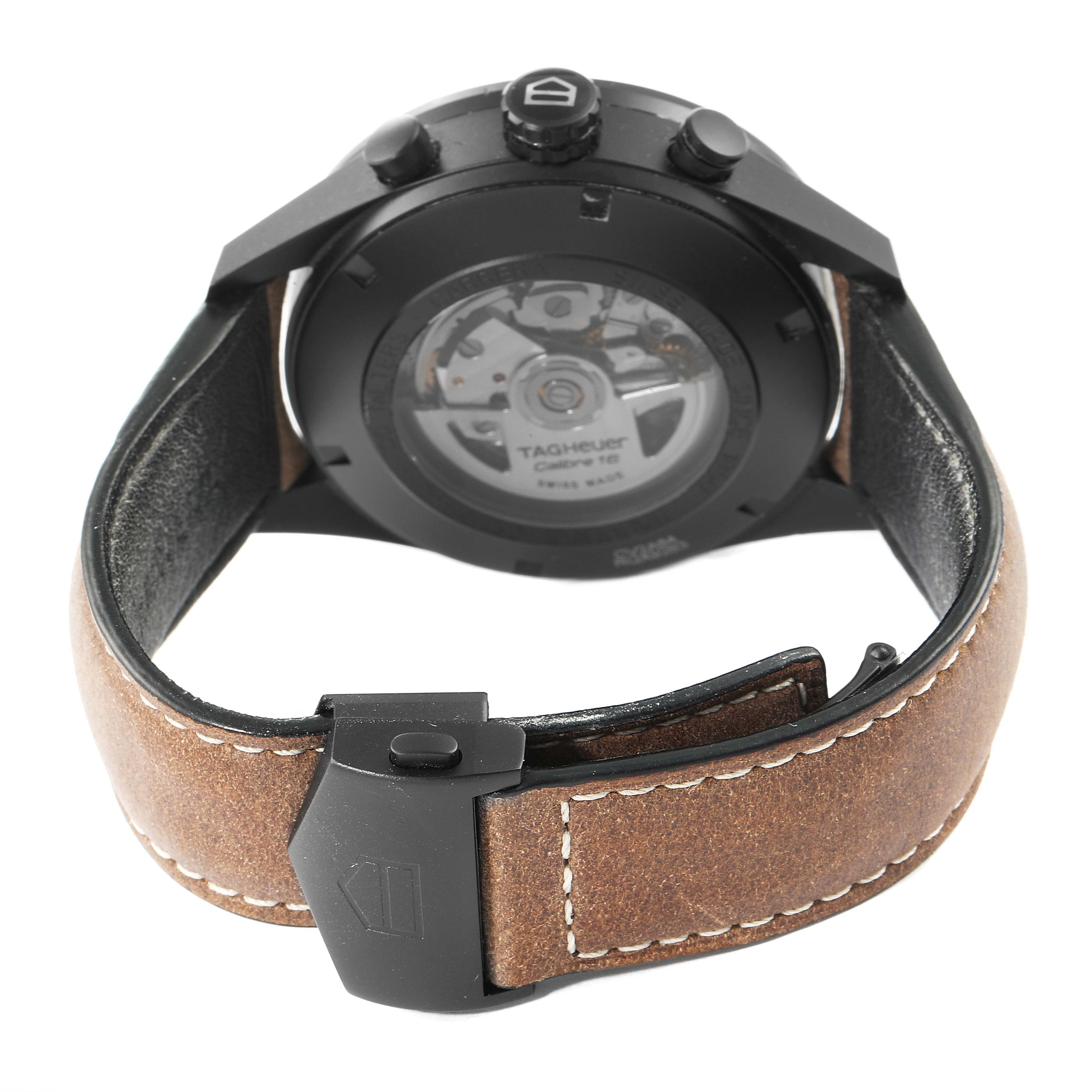 The image shows the back view of a Tag Heuer Carrera CV2A84.FC6394 Men's Titanium Black Dial CV2A84.FC6394 Men's Titanium Black Dial watch, highlighting its automatic movement and leather strap with a buckle.