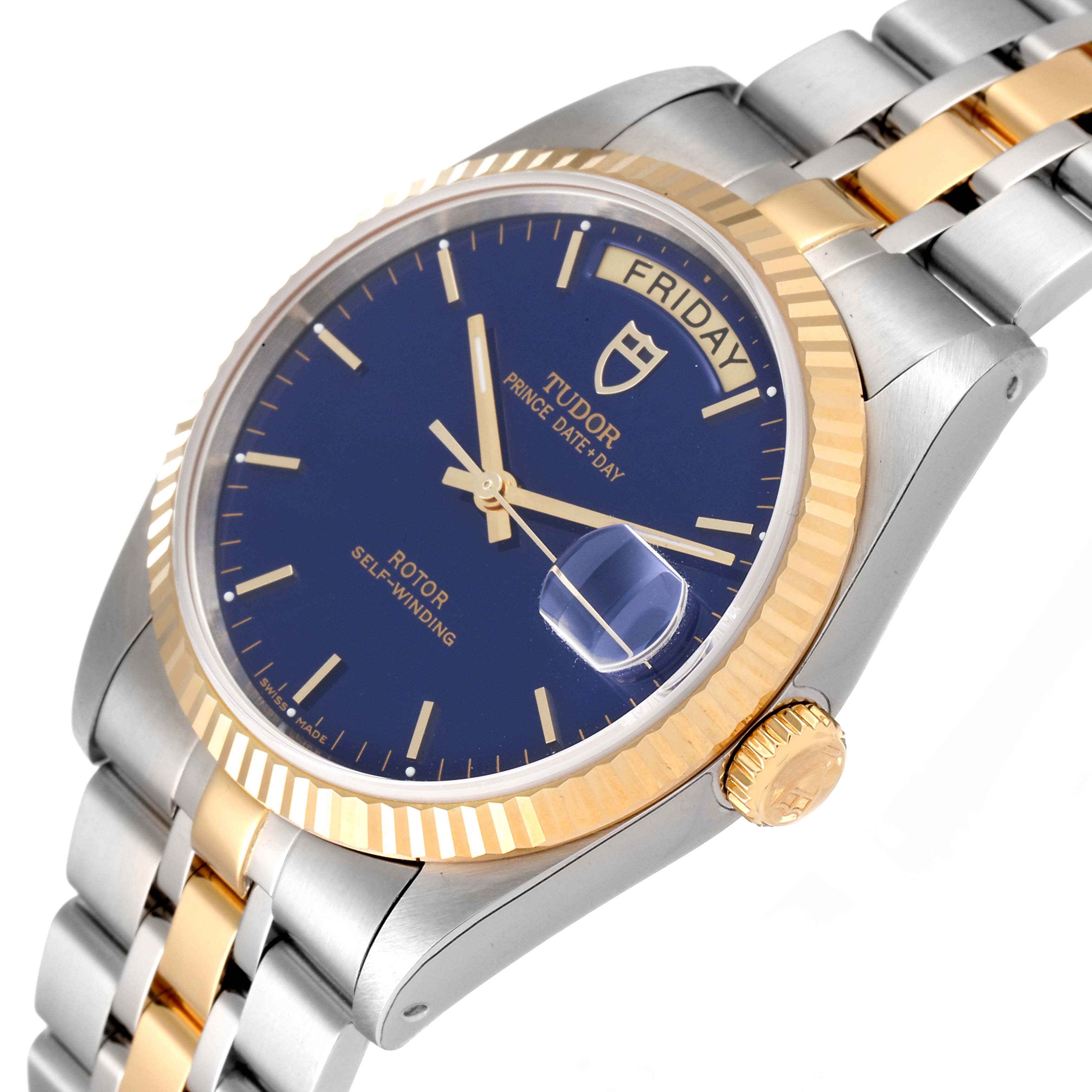 The Tudor Prince 76213 Men
s Steel and Gold (two tone) Blue Dial 76213 Men
s Steel and Gold (two tone) Blue Dial Date-Day watch is shown at an angled view highlighting the face, bezel, crown, and partly the bracelet.