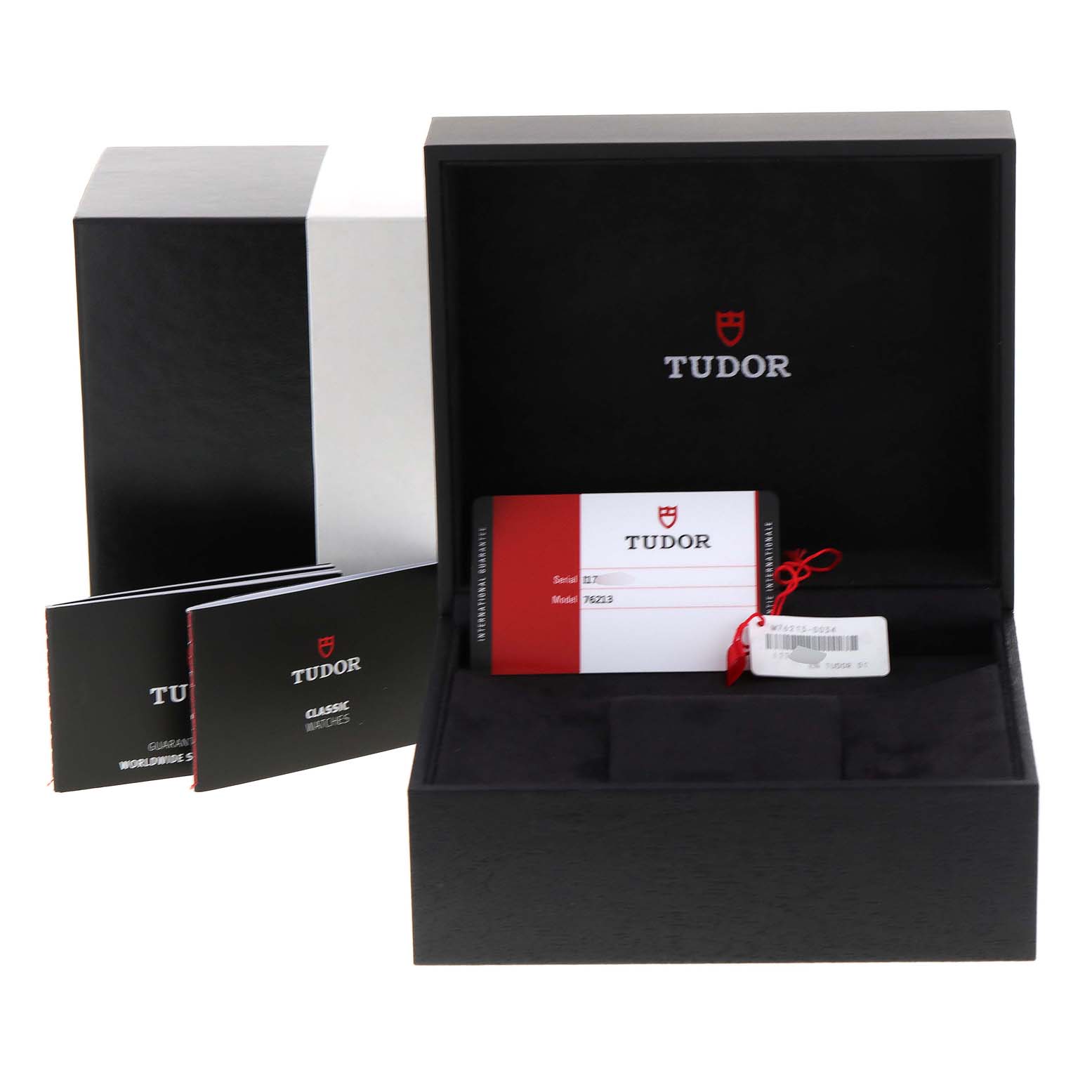The image shows the box, warranty cards, and booklet for the Tudor Prince 76213 Men
s Steel and Gold (two tone) Blue Dial 76213 Men
s Steel and Gold (two tone) Blue Dial watch, photographed at a slightly elevated angle.