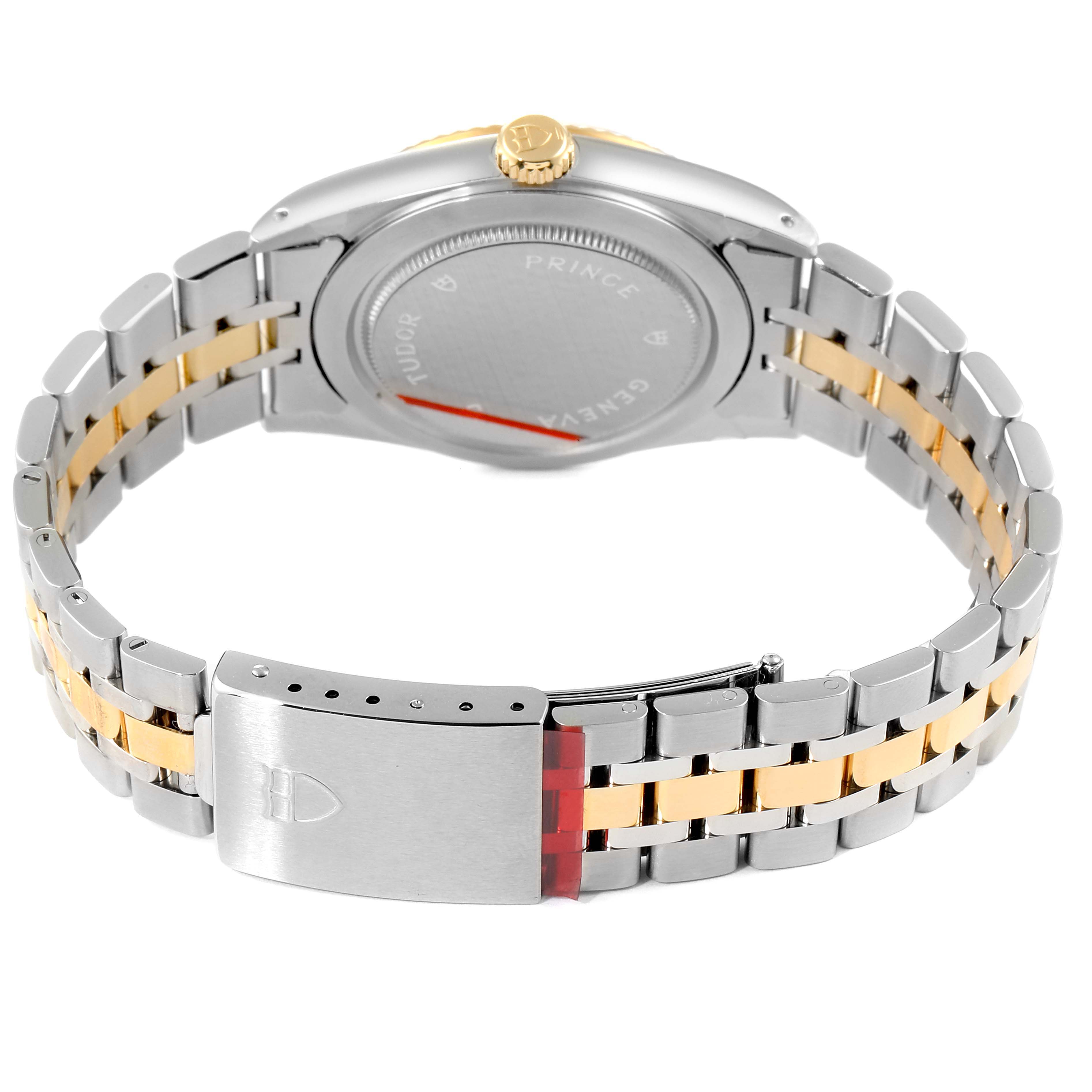 The image shows the back view of the Tudor Prince 76213 Men
s Steel and Gold (two tone) Blue Dial 76213 Men
s Steel and Gold (two tone) Blue Dial watch, highlighting the case, crown, and two-tone bracelet with a clasp.