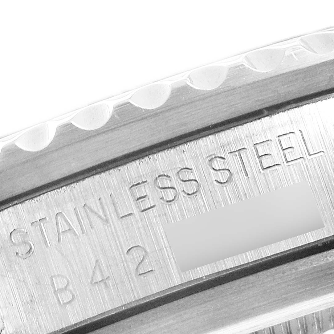 This close-up image shows the rim and stainless steel engravings on a Tudor Submariner 79090 Men's Stainless Steel Black Dial 79090 Men's Stainless Steel Black Dial watch.