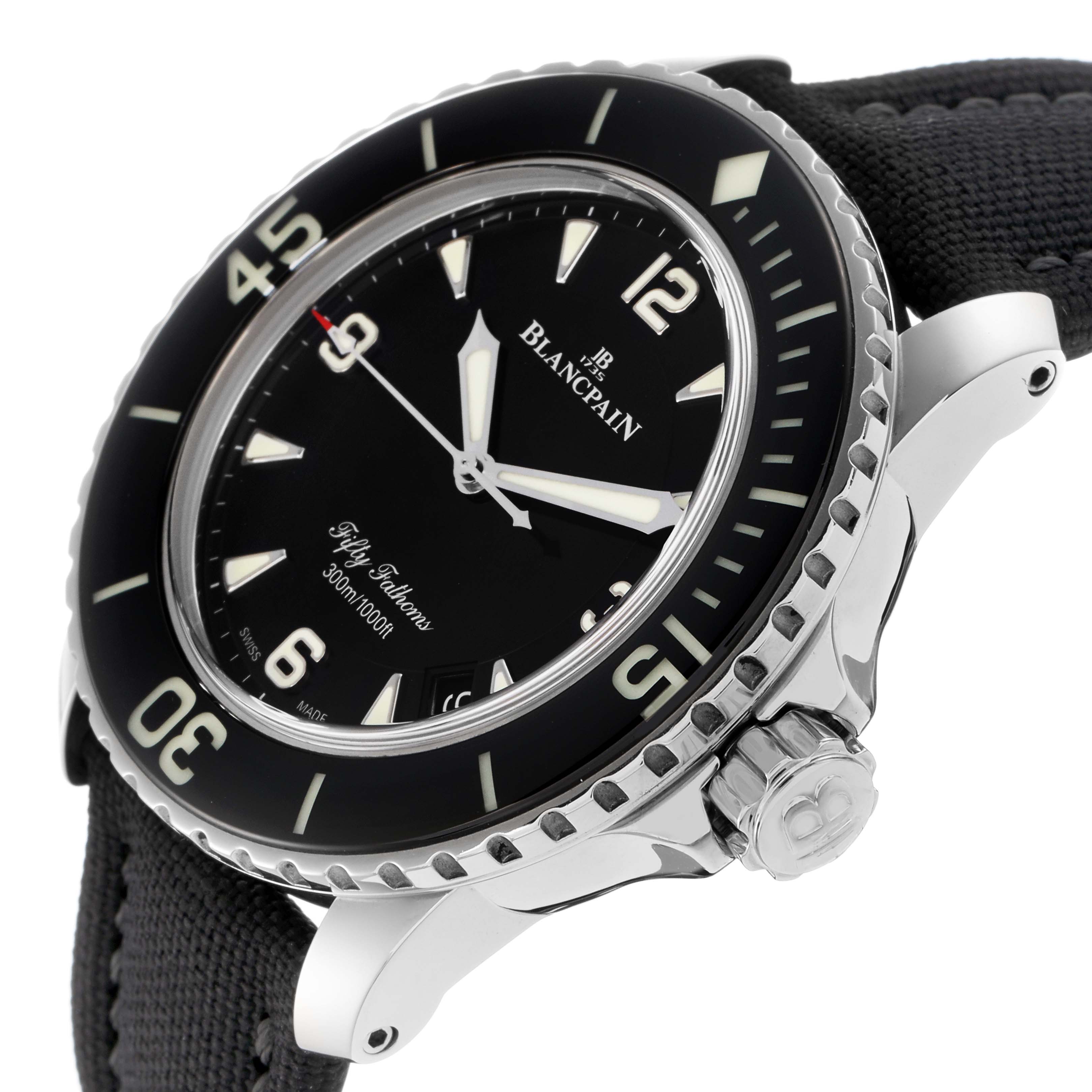 The Blancpain Fifty Fathoms 5015-1130-715 watch is shown at an angle, highlighting its dial, bezel, crown, and partially the strap.