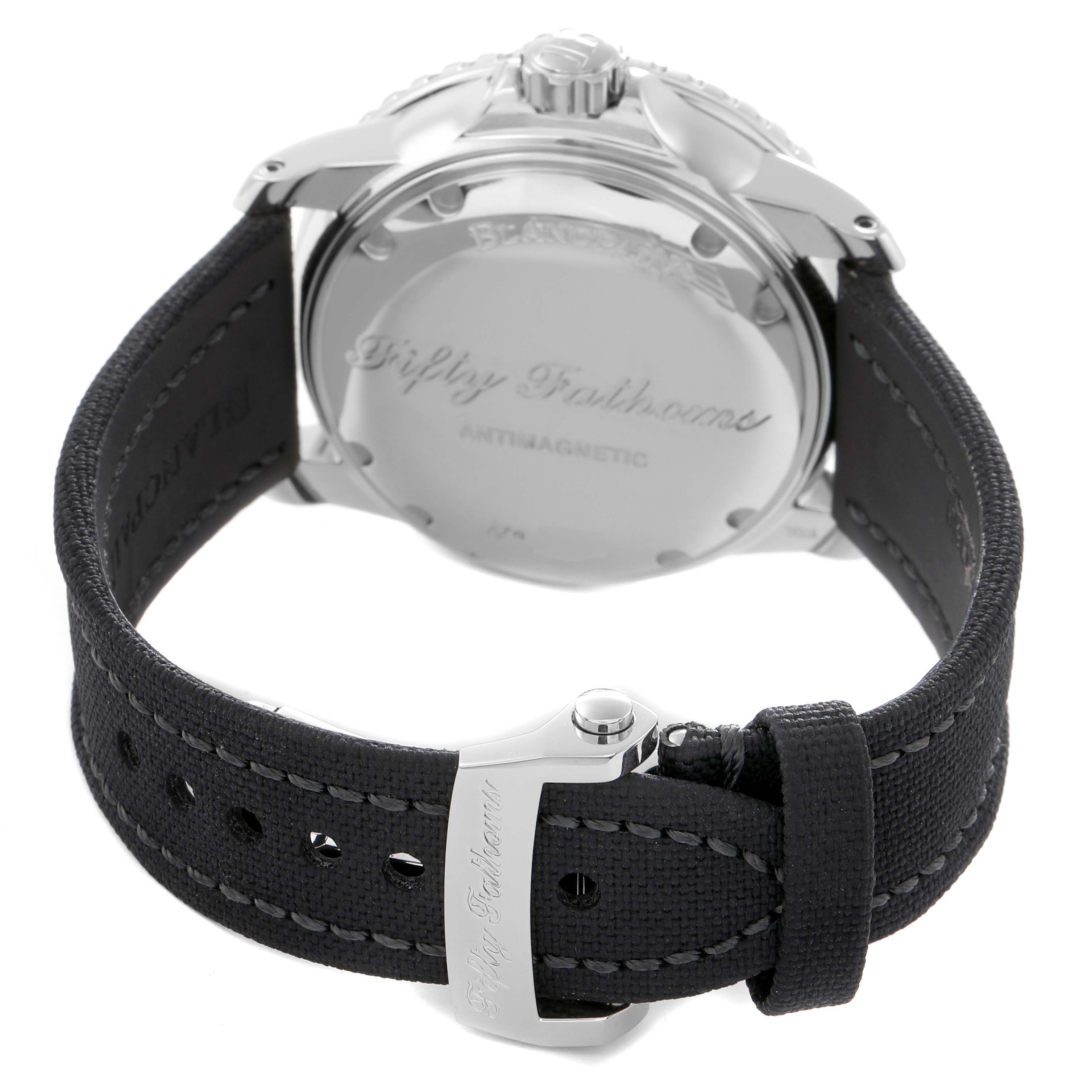 The image shows the back of the Blancpain Fifty Fathoms model 5015-1130-715 watch, highlighting its case back and strap with stitching and buckle.