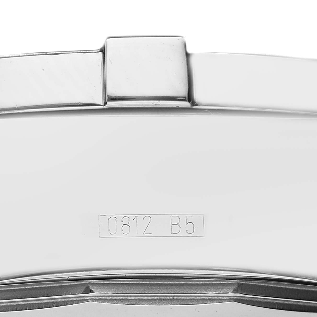This image shows a close-up of the case back of a Breitling Superocean model A13340, focusing on the edge and engraved serial number.