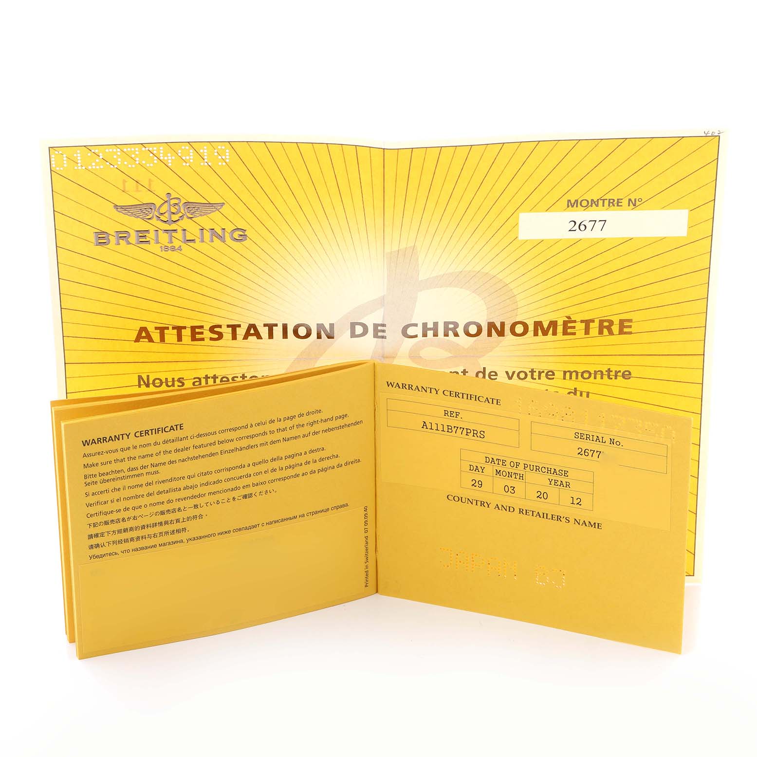 The image shows the warranty certificate and attestation booklet for a Breitling Superocean model, model number A13340, with the certificate open displaying details.