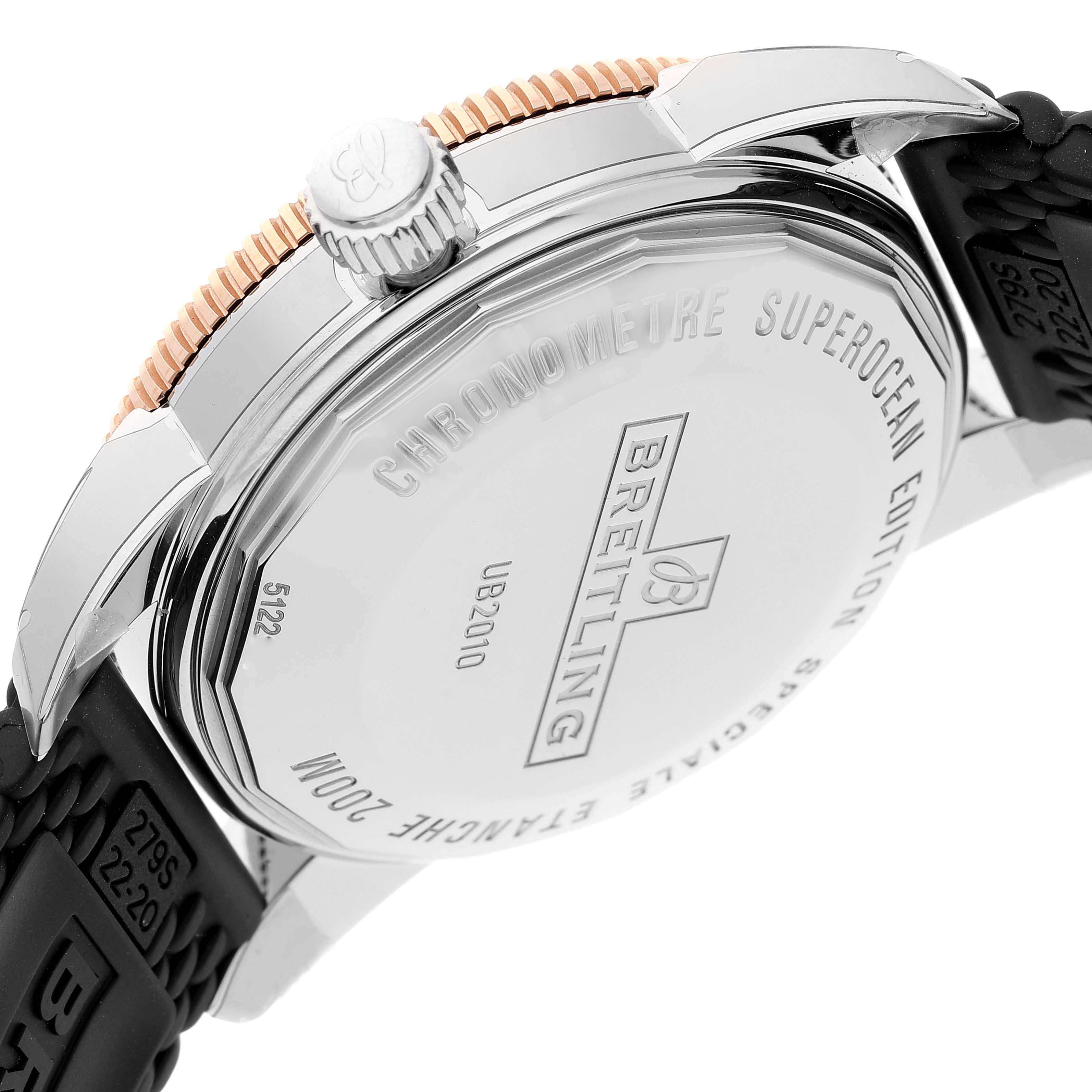 This image shows the case back and crown of the Breitling Superocean UB2010 Men's Steel and Gold (two tone) Black Dial UB2010 Men's Steel and Gold (two tone) Black Dial watch along with part of the strap.