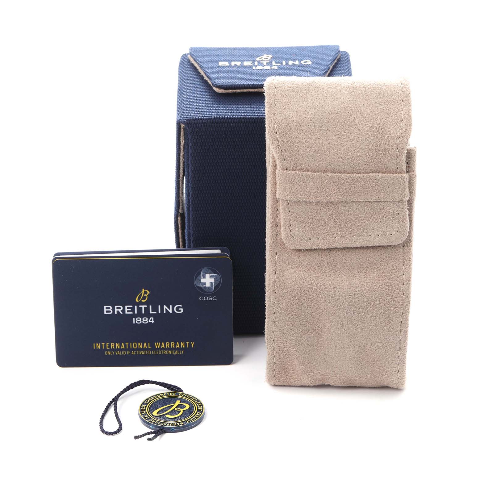 The image shows the accessories for a Breitling Superocean model U17368 men
s watch, including a box, warranty card, suede pouch, and hangtag.