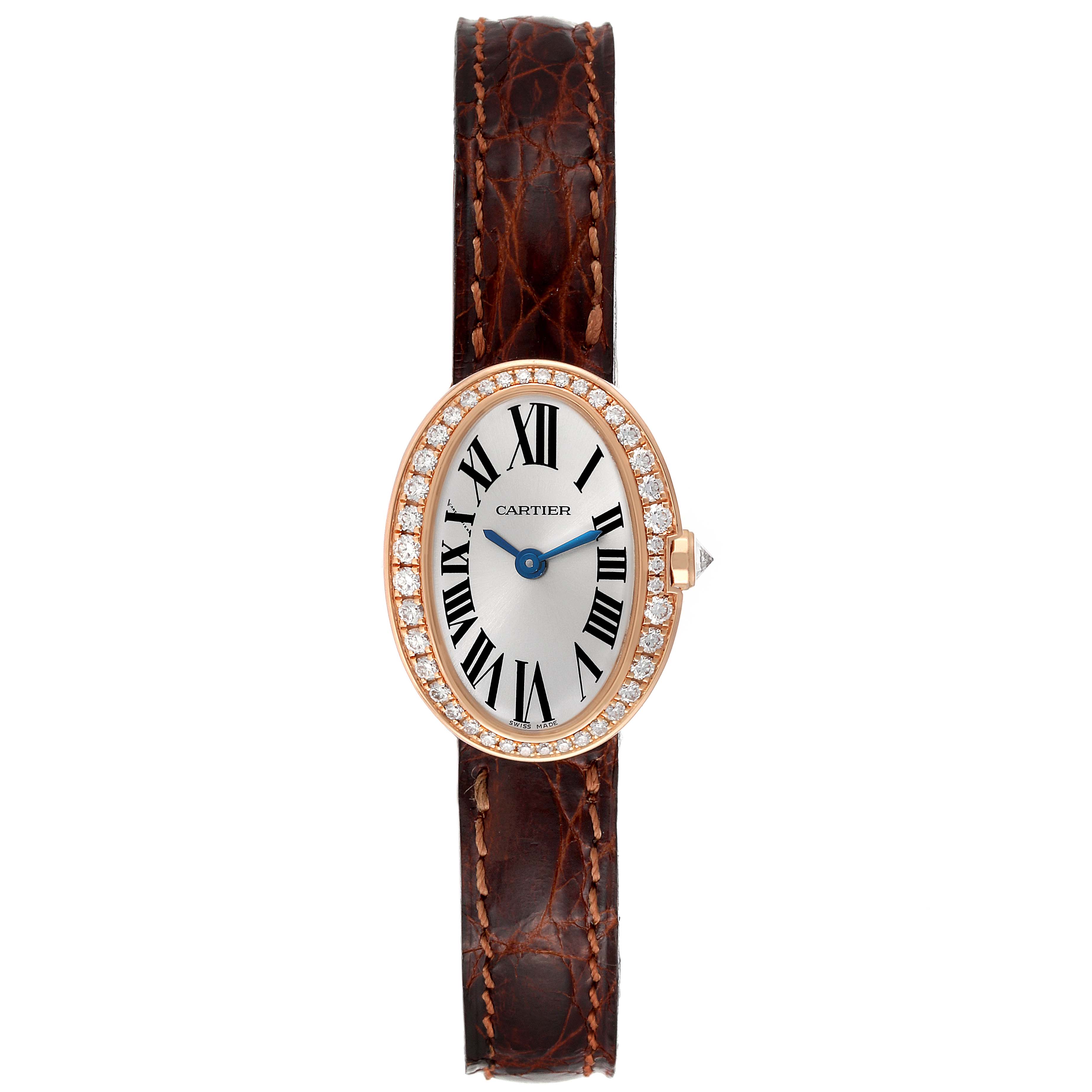 The Cartier Baignoire WB520028 Women
s Rose Gold Silver Dial WB520028 Women
s Rose Gold Silver Dial watch is shown from a top-down angle, displaying its oval face, diamond bezel, Roman numerals, and brown leather strap.