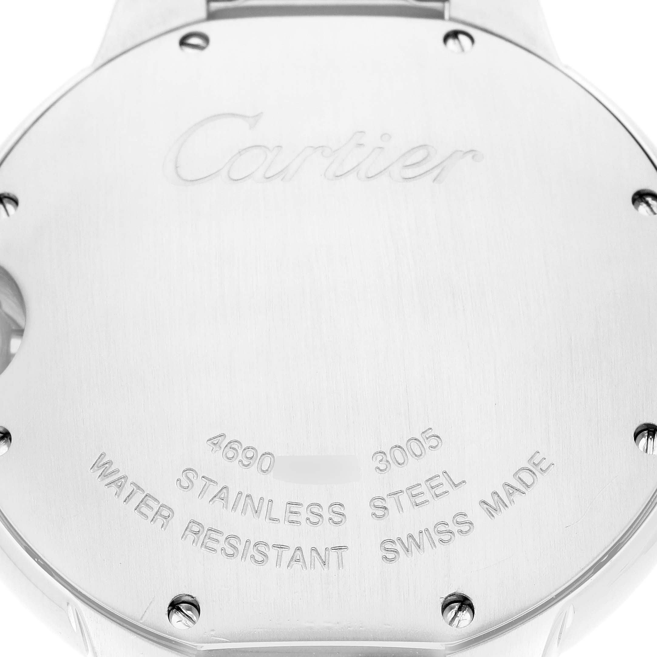 The image shows the back case of a Cartier Ballon Bleu model W69011Z4, highlighting the engraved details and screw details on the stainless steel back.