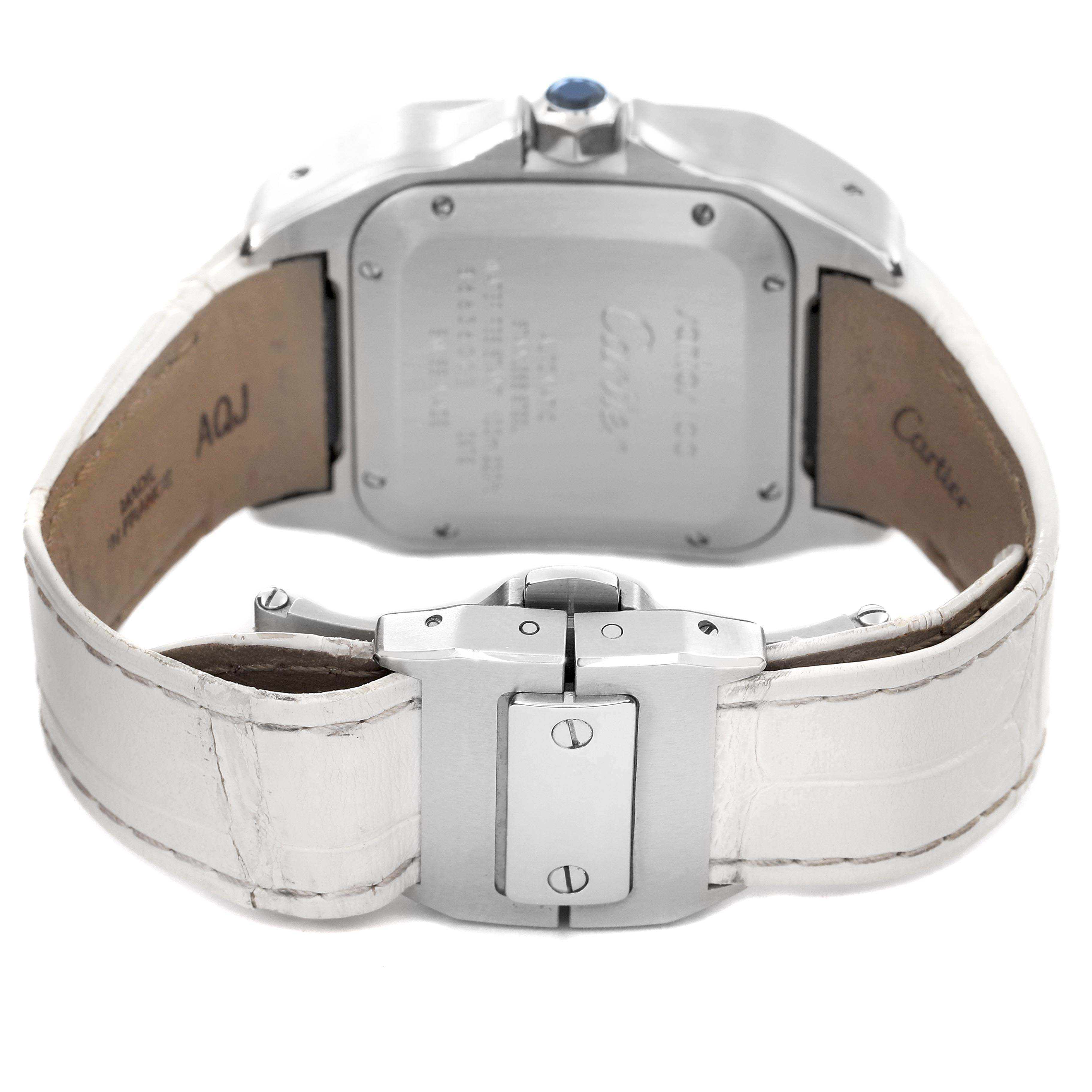 The image shows the back case and clasp of a Santos model by Cartier, highlighting the leather strap and case back.