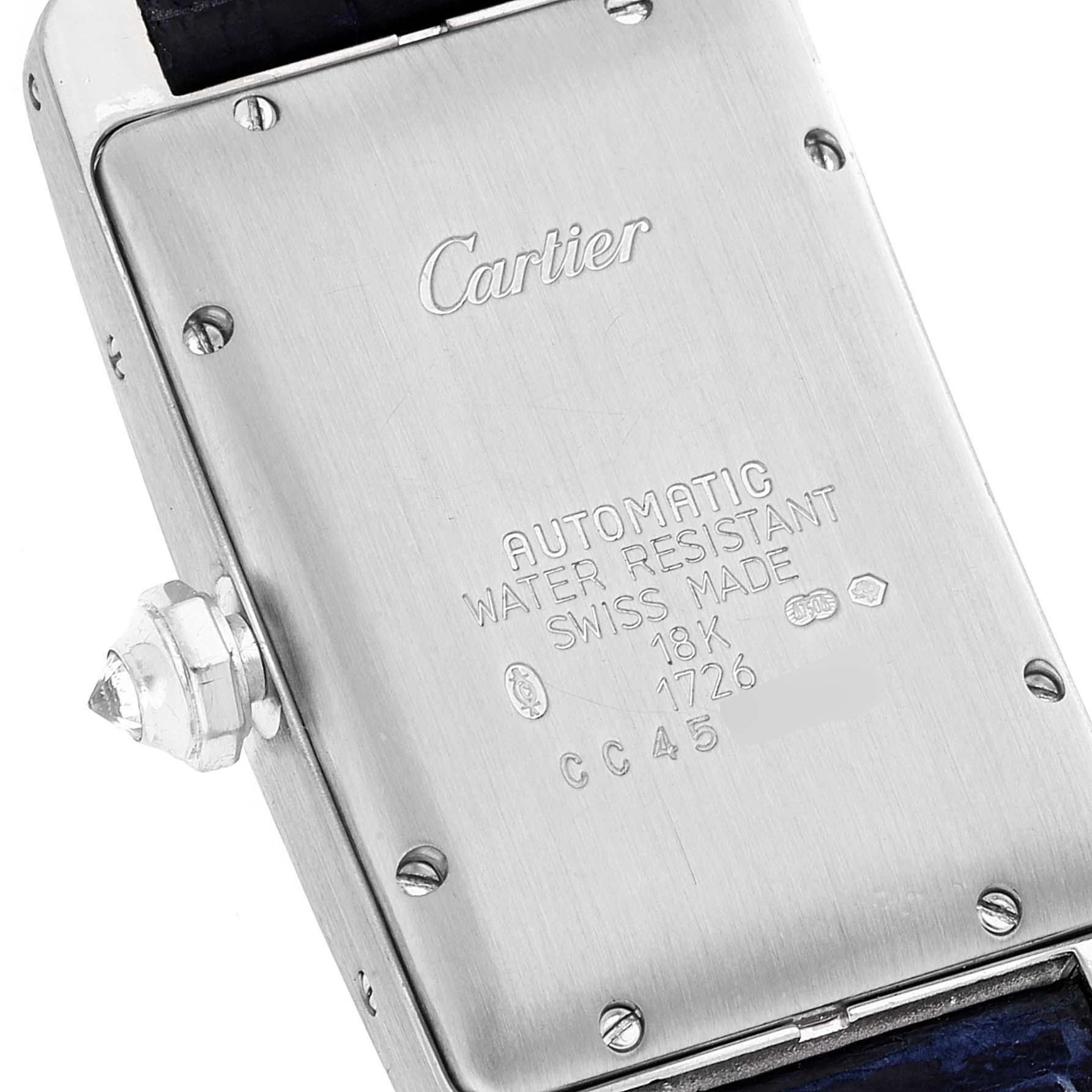 This image shows the back case of a Cartier Tank Americaine 1726 Women's White Gold Silver Dial 1726 Women's White Gold Silver Dial watch, highlighting its engraving and crown detail.