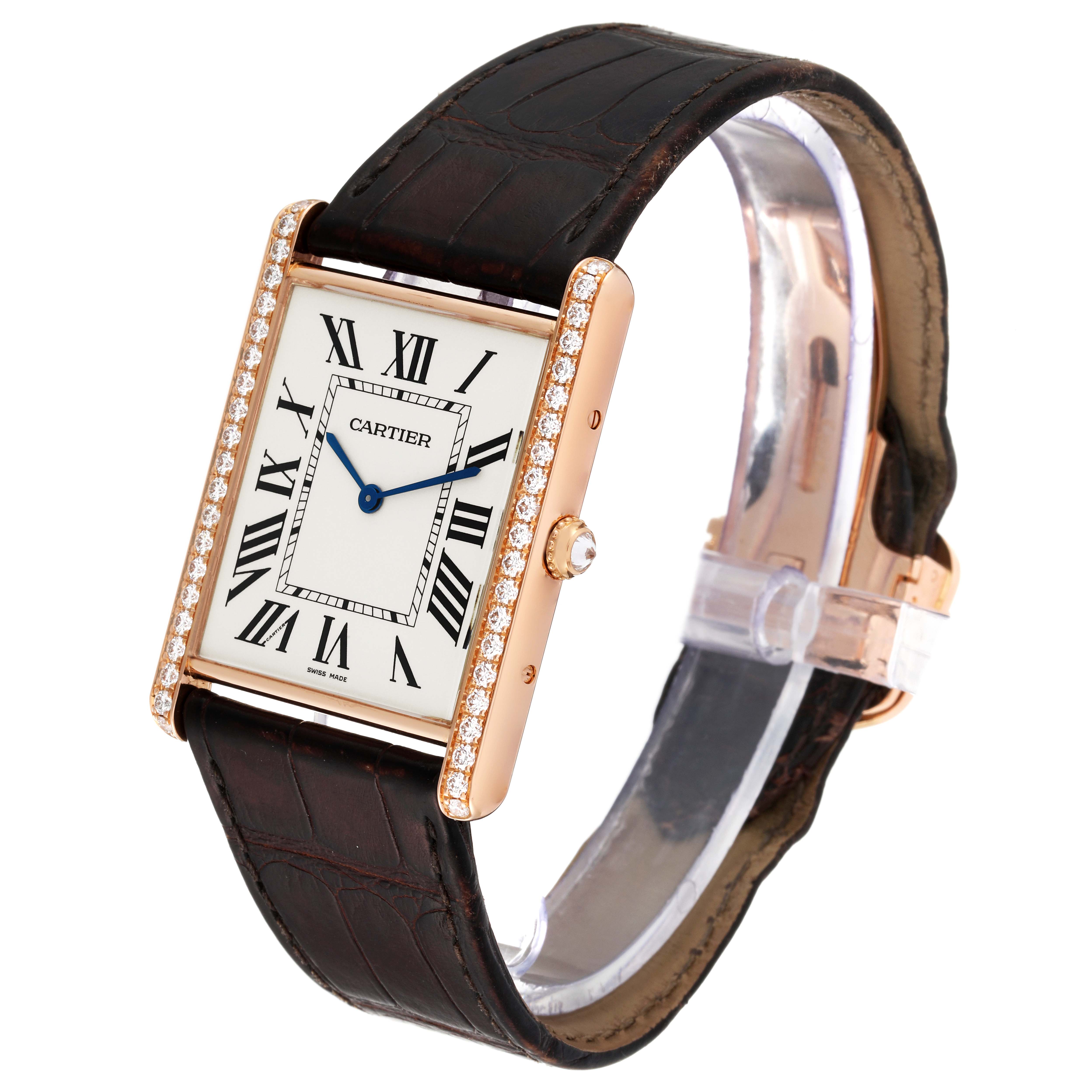 The Cartier Tank Louis WT200005 Men's Rose Gold Silver Dial WT200005 Men's Rose Gold Silver Dial watch is shown from an angled view displaying its face, strap, and case with diamonds along the edges.