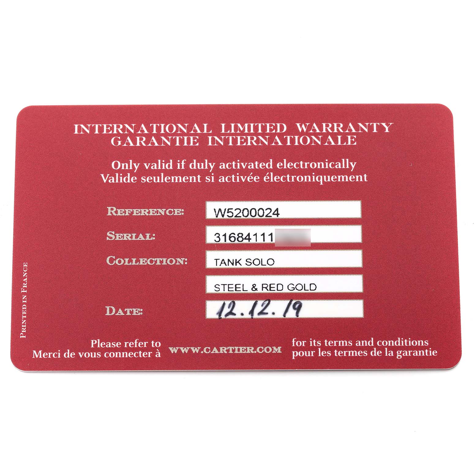 The image shows a Cartier international limited warranty card for the Tank Solo model, in steel and red gold configuration.