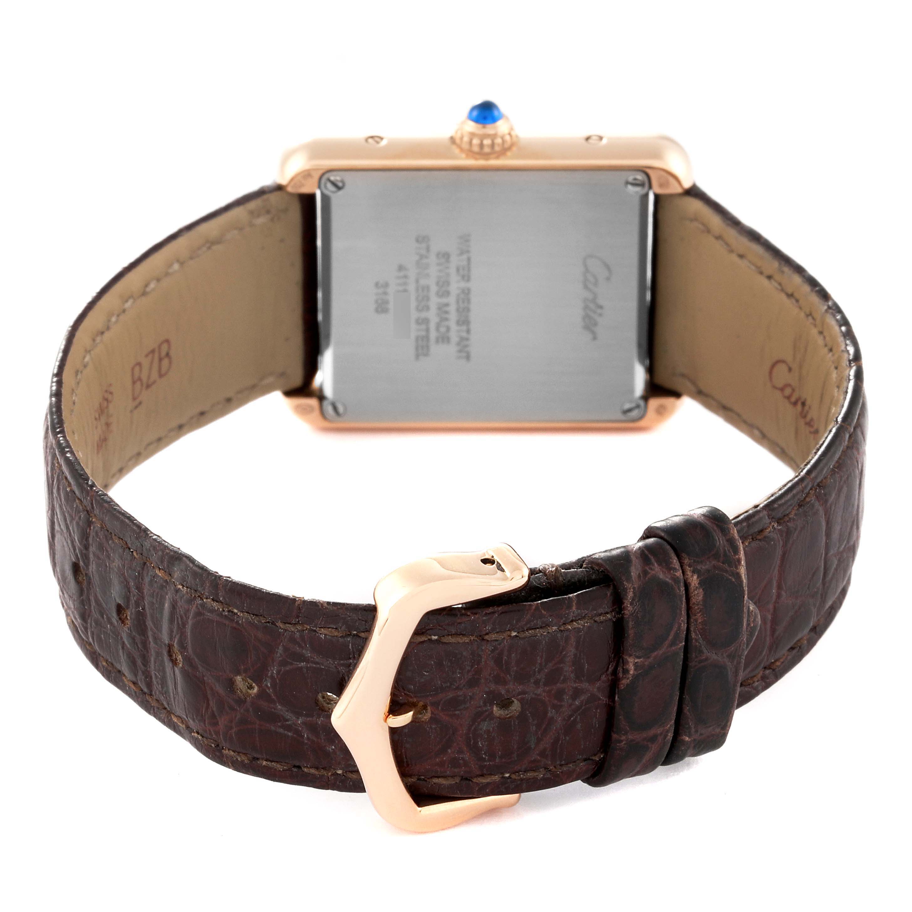 The image shows the back view of a Cartier Tank Solo W5200024 Women
s Steel and Gold (two tone) Silver Dial W5200024 Women
s Steel and Gold (two tone) Silver Dial watch, focusing on the case back and the leather strap with a buckle.