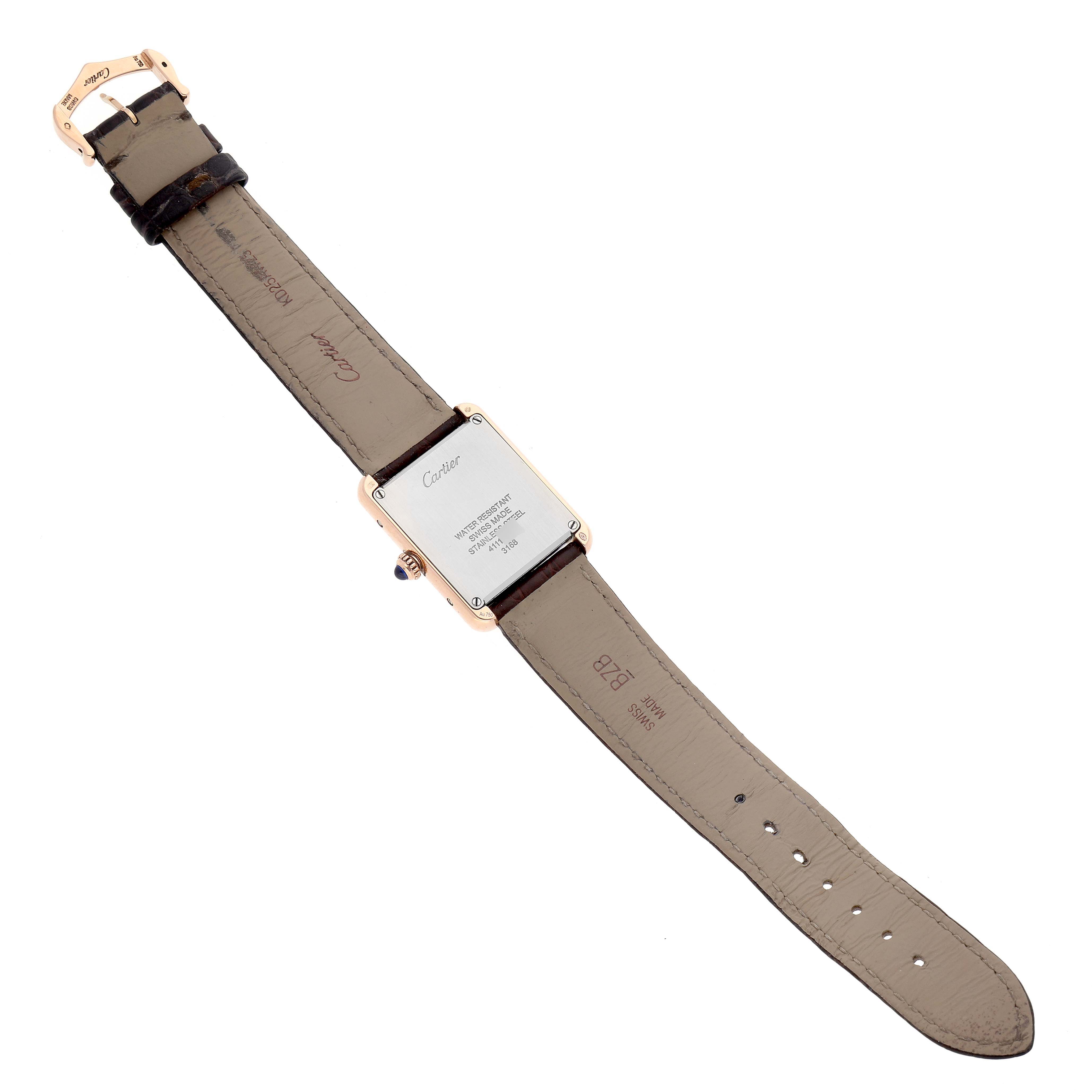 The image shows the back view of a Cartier Tank Solo W5200024 Women
s Steel and Gold (two tone) Silver Dial W5200024 Women
s Steel and Gold (two tone) Silver Dial watch, highlighting the case back and leather strap.