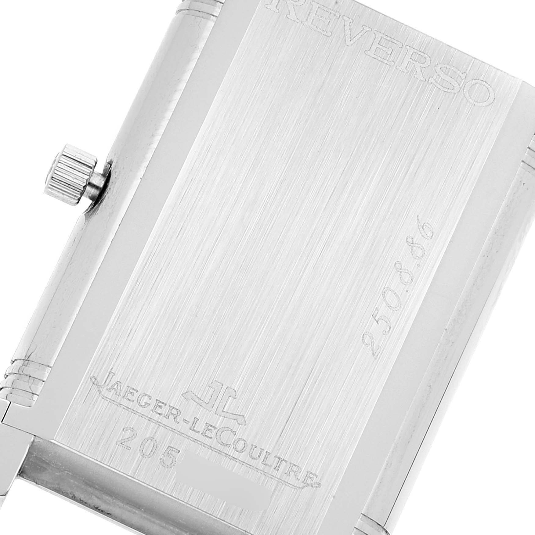 The image shows the back of a Jaeger LeCoultre Reverso 250.8.86 Men's Stainless Steel Silver Dial 250.8.86 Men's Stainless Steel Silver Dial watch, showcasing the crown, engravings, and brushed metal finish.